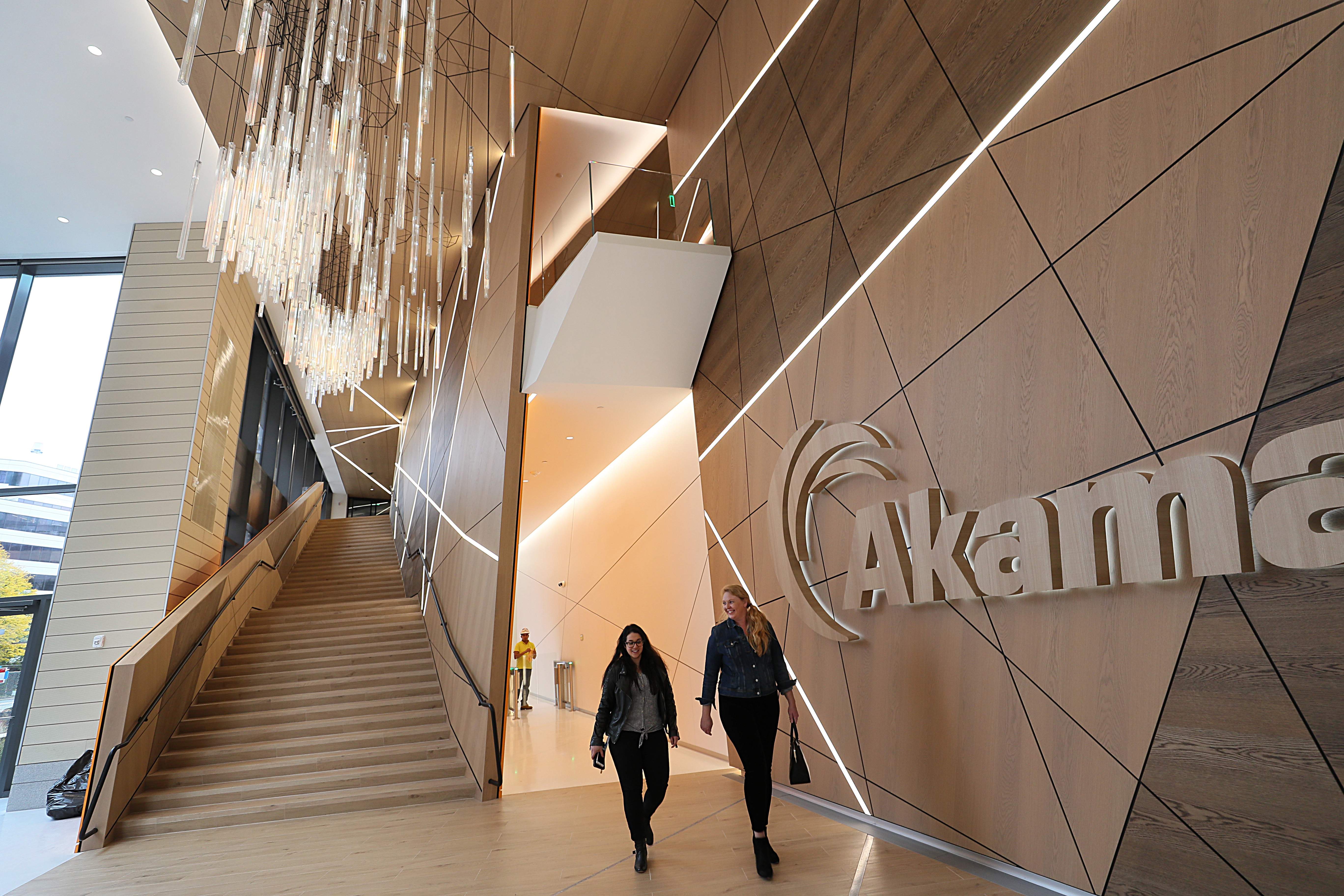 People walk in the main lobby inside Akamai's new headquarters