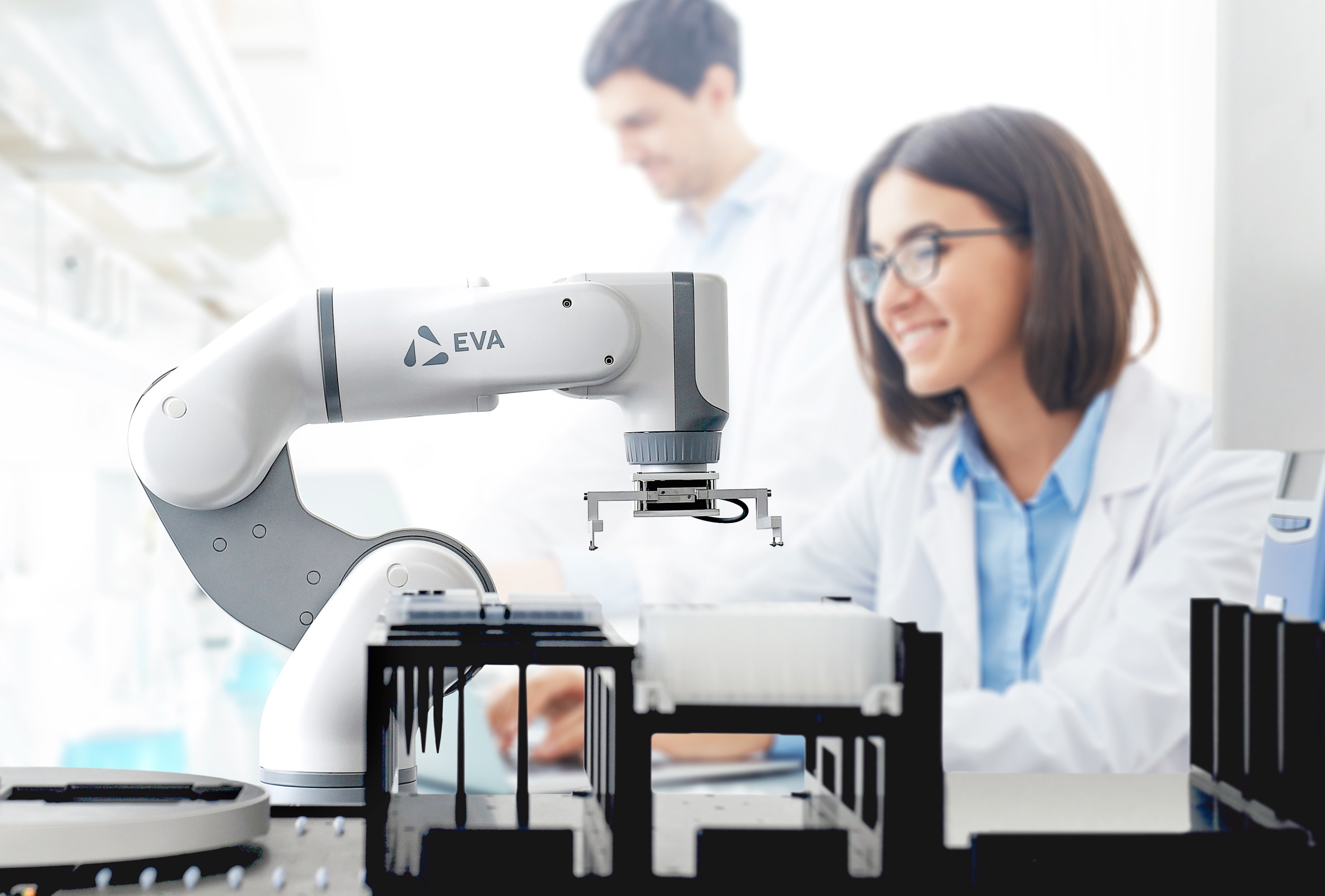 A robotic arm interacts with vials in a lab setting.