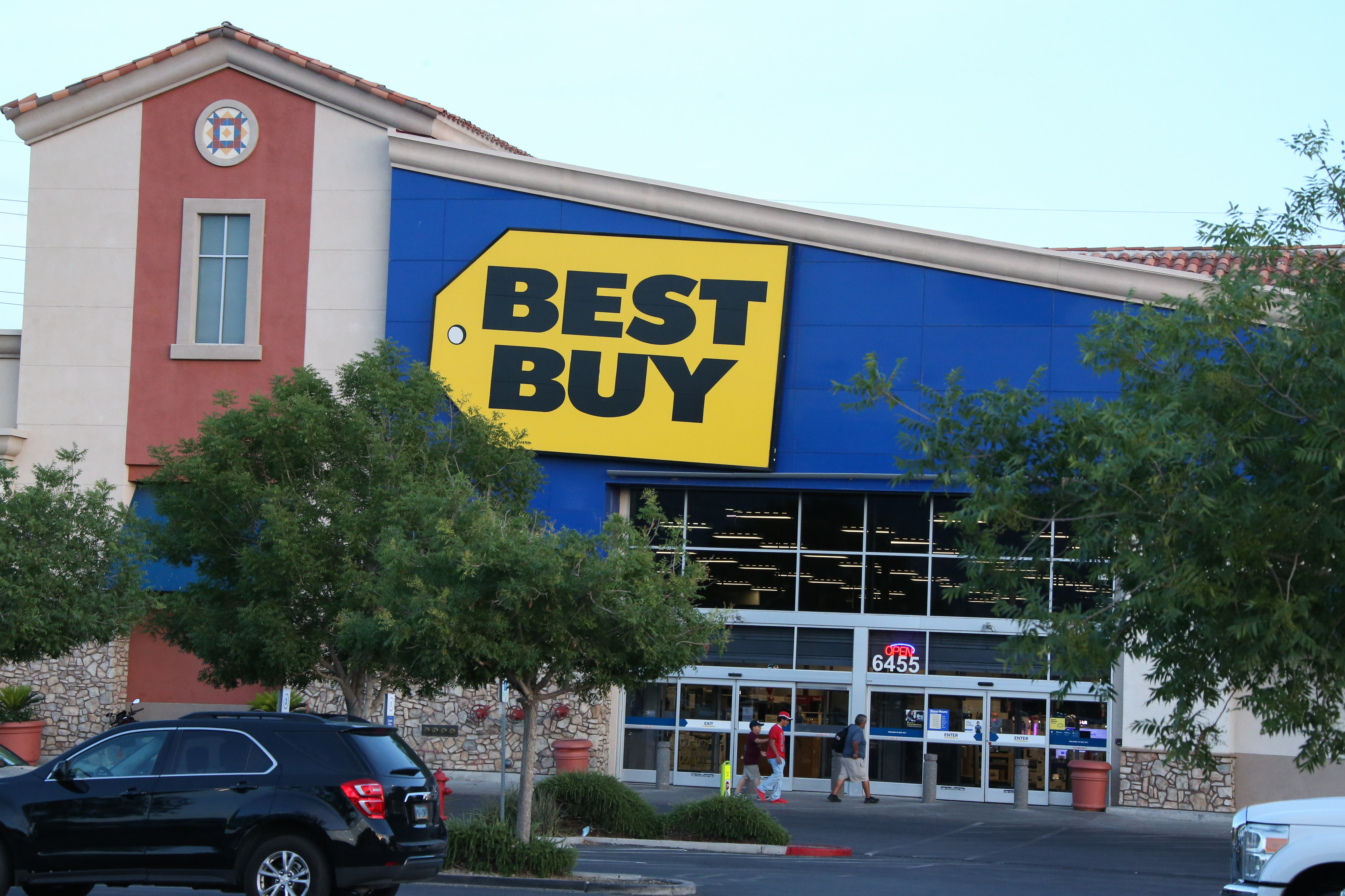 A Best Buy logo is seen displayed on the exterior of their