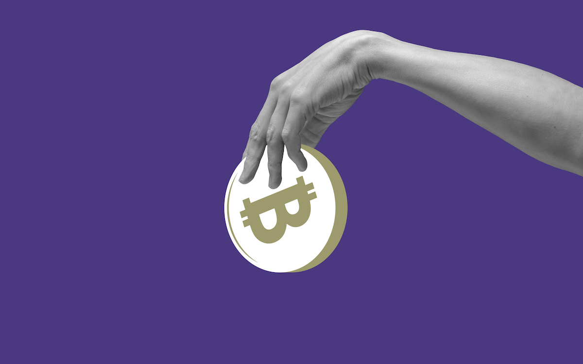 Hand holding a large abstract bitcoin against a purple backdrop, used in a post about Zipmex