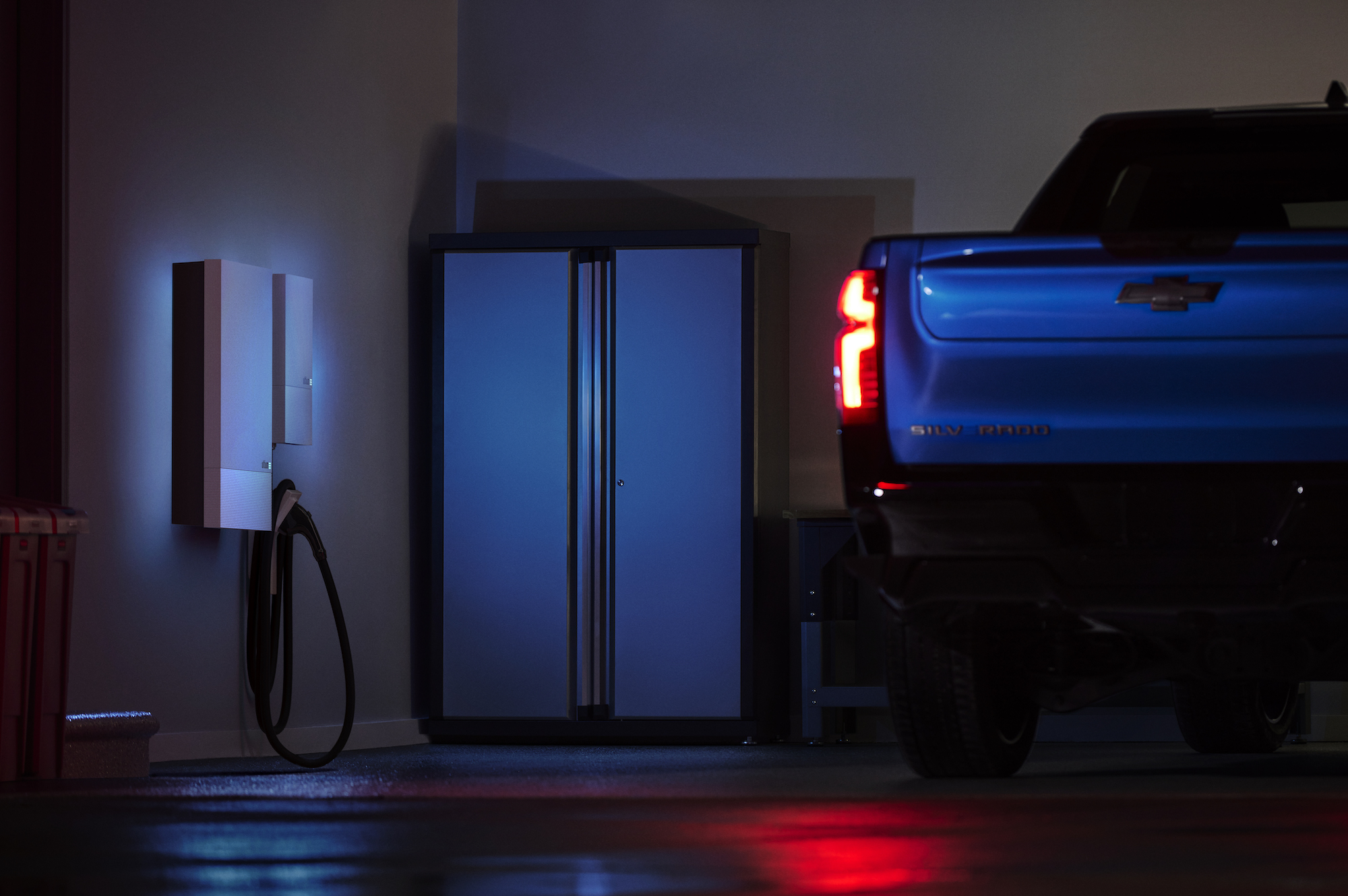 electric truck in garage with wall charging unit