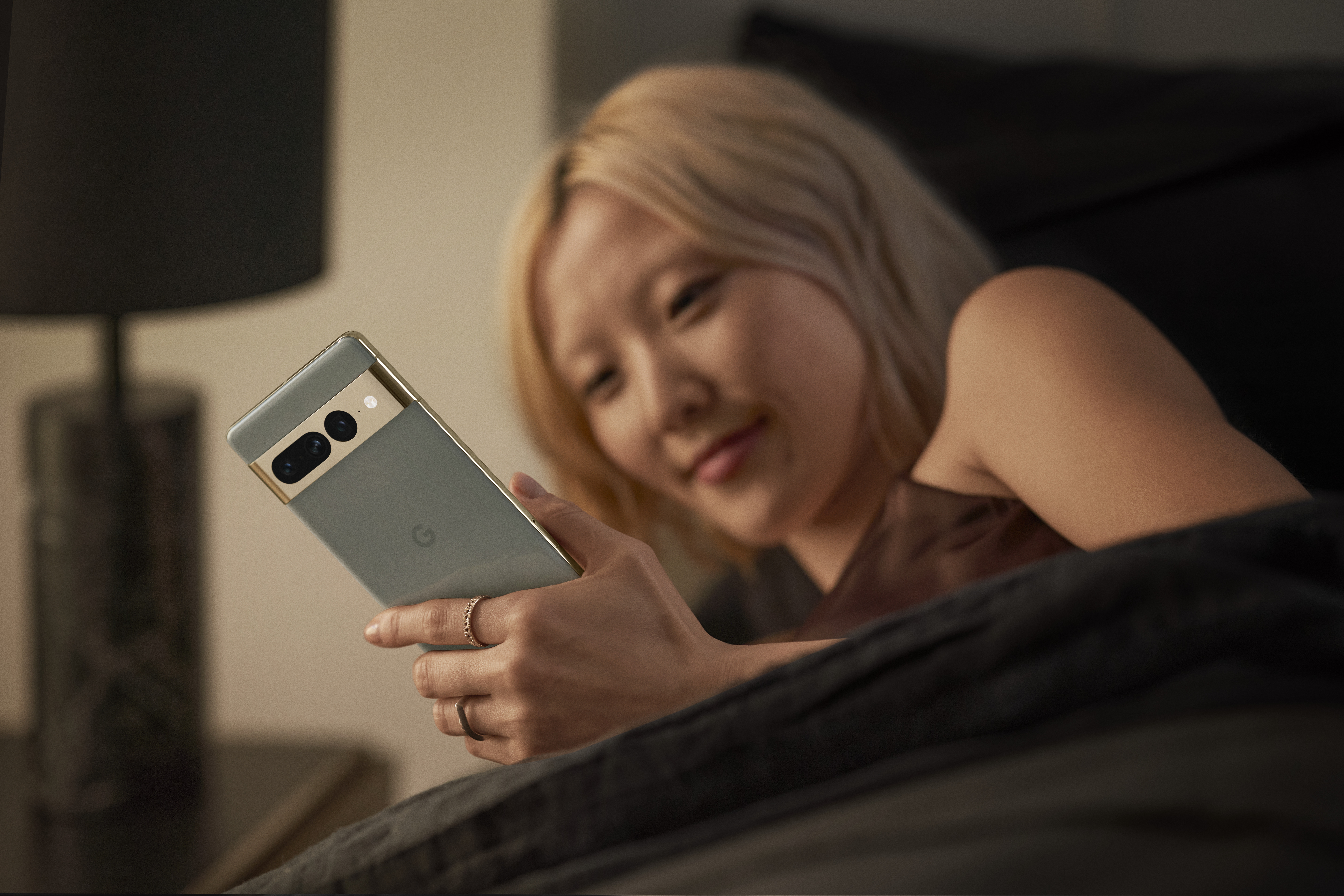 young woman staring at smartphone