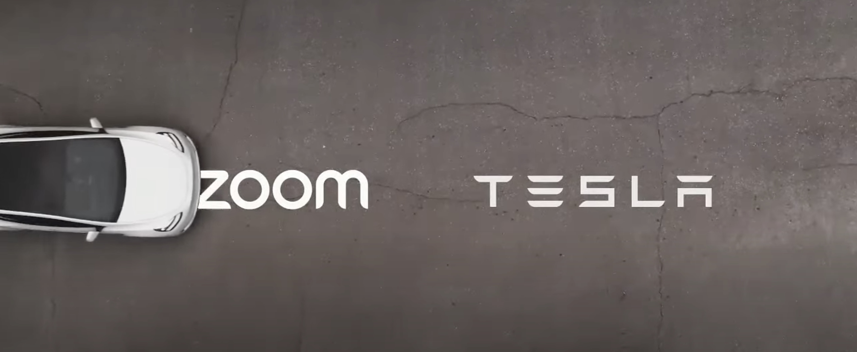 A white Tesla drives over two logos, the Zoom logo and Tesla logo.