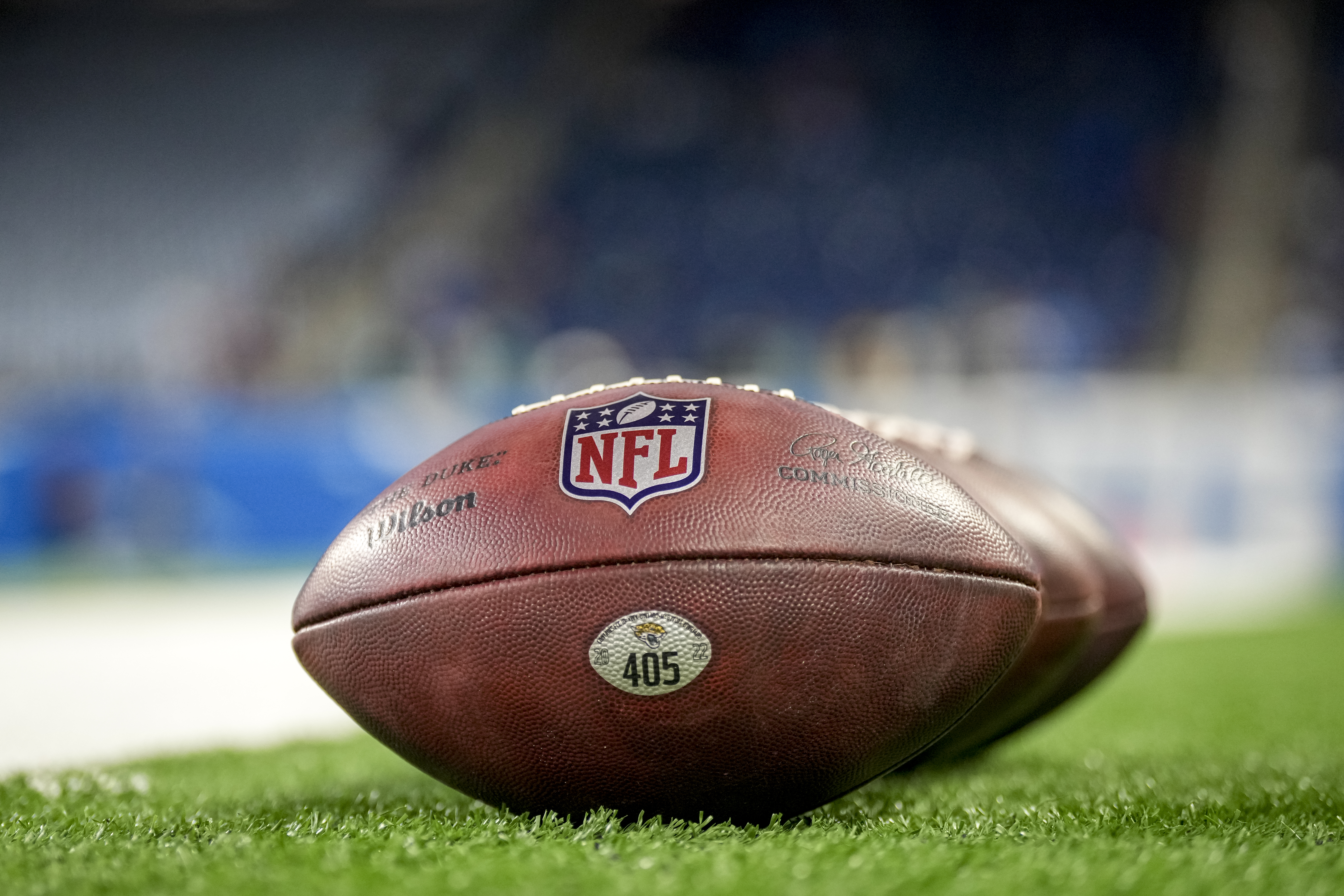 NFL logo footballs sitting on field