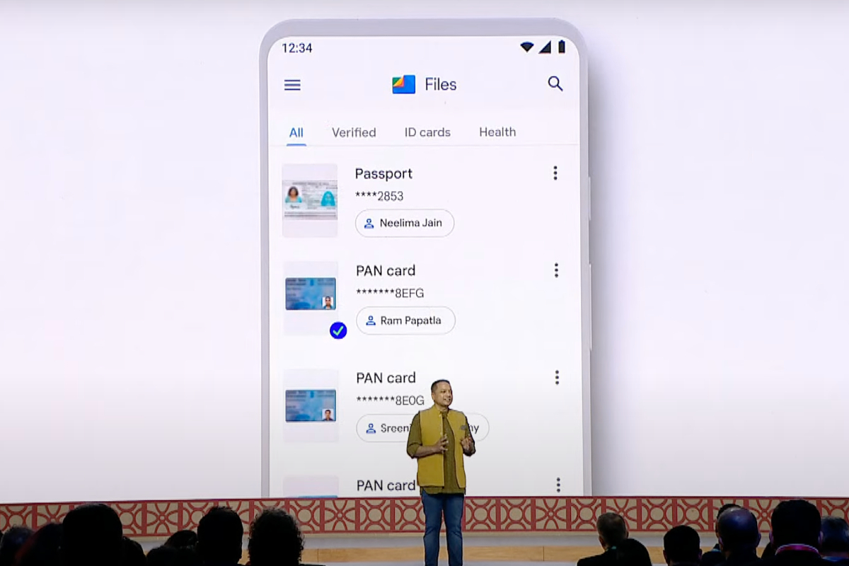 Ggoogle Files integrating DigiLocker displayed on a large screen behind a man talking onstage