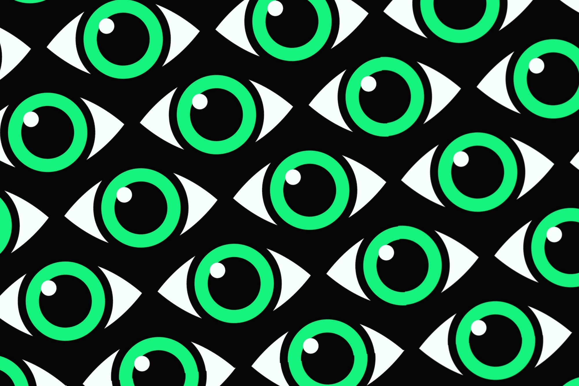 Green eyes with a white glint on a patterned black background.