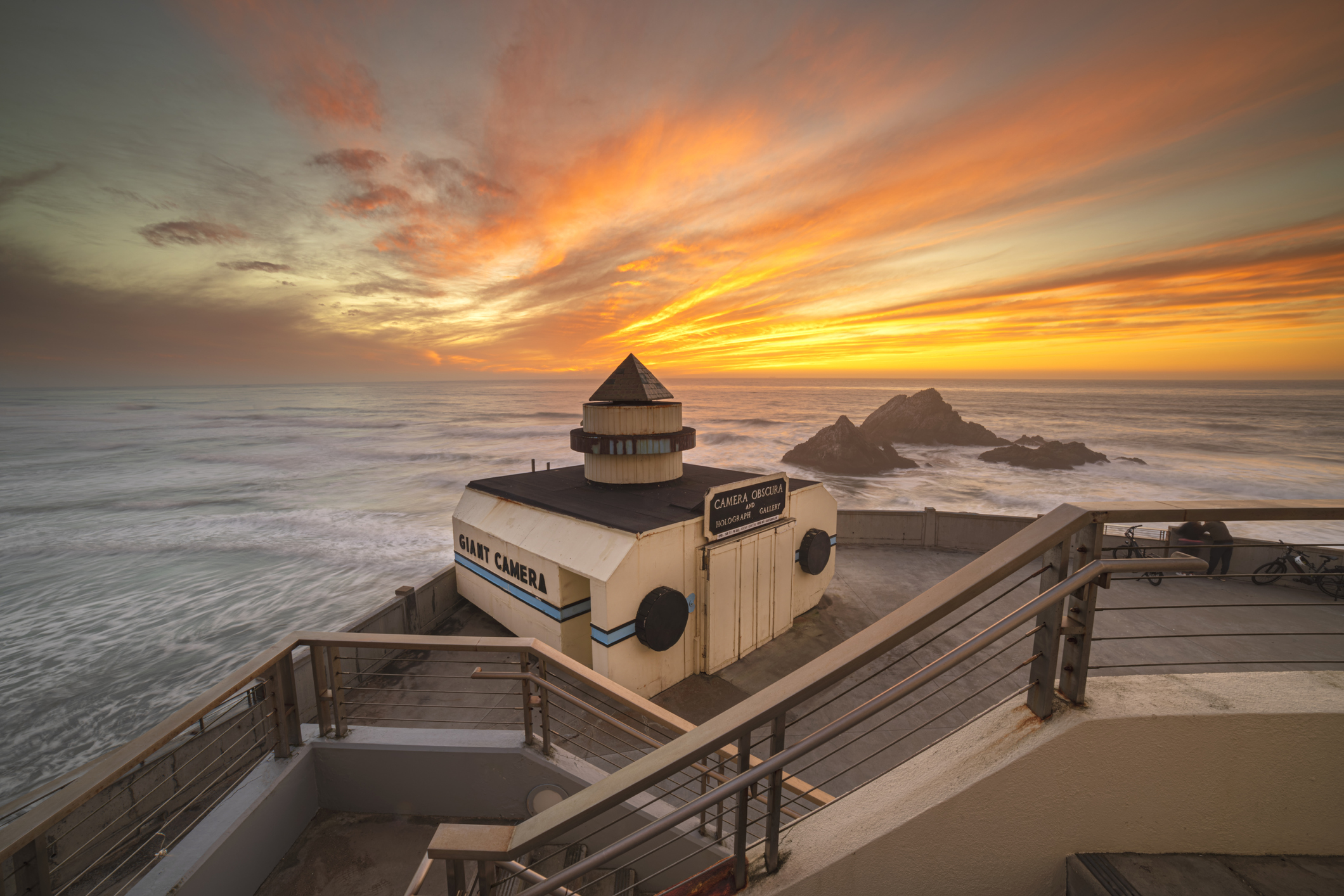 Ocean beach sunset by the Giant Camera behind Cliff House