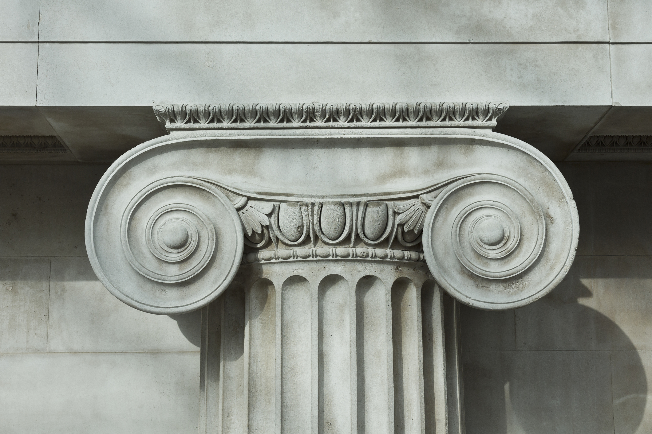 detailed carving on a pillar supporting a building