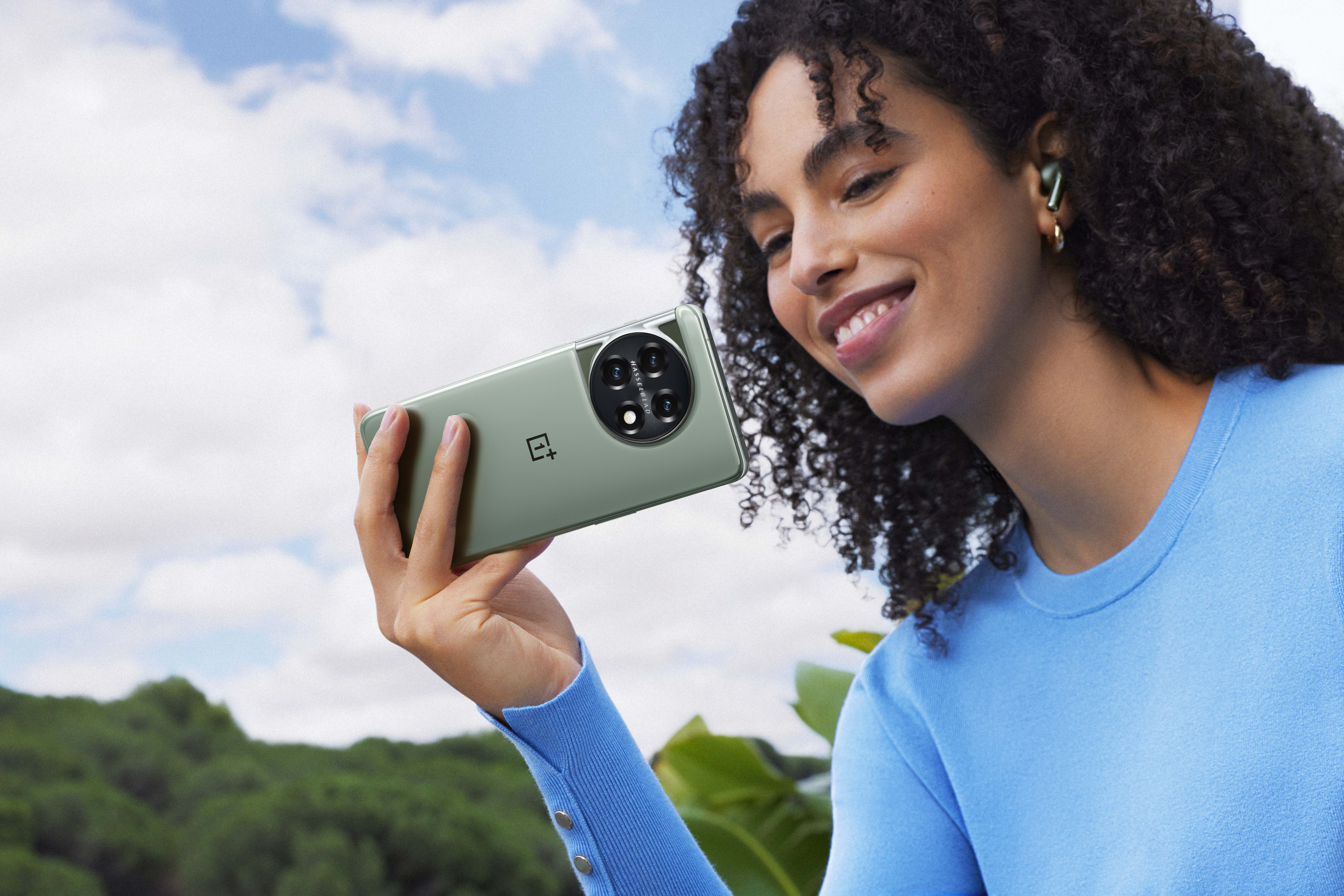 Woman holding OnePlus smartphone