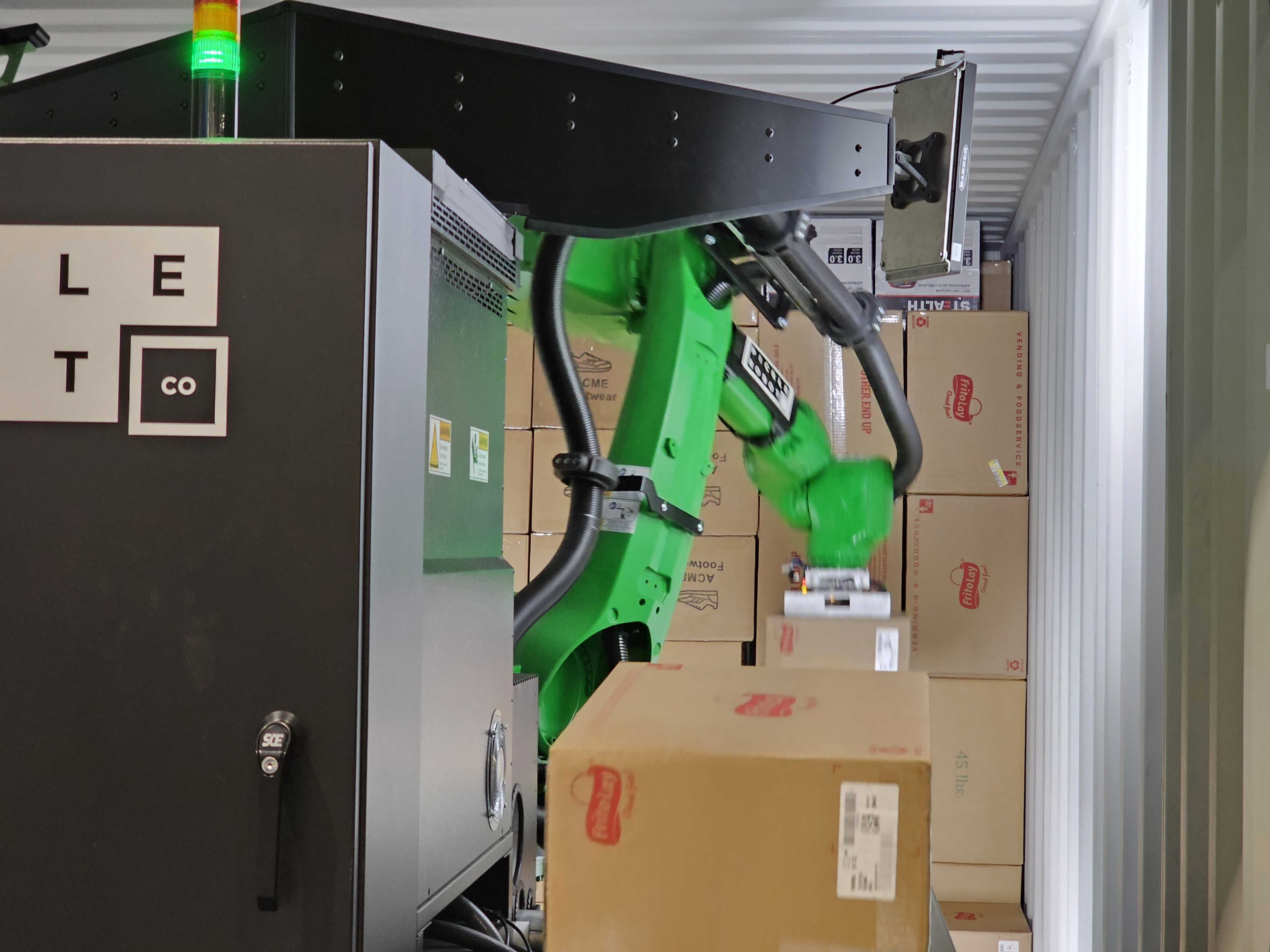 Pickle's truck unloading robot arm