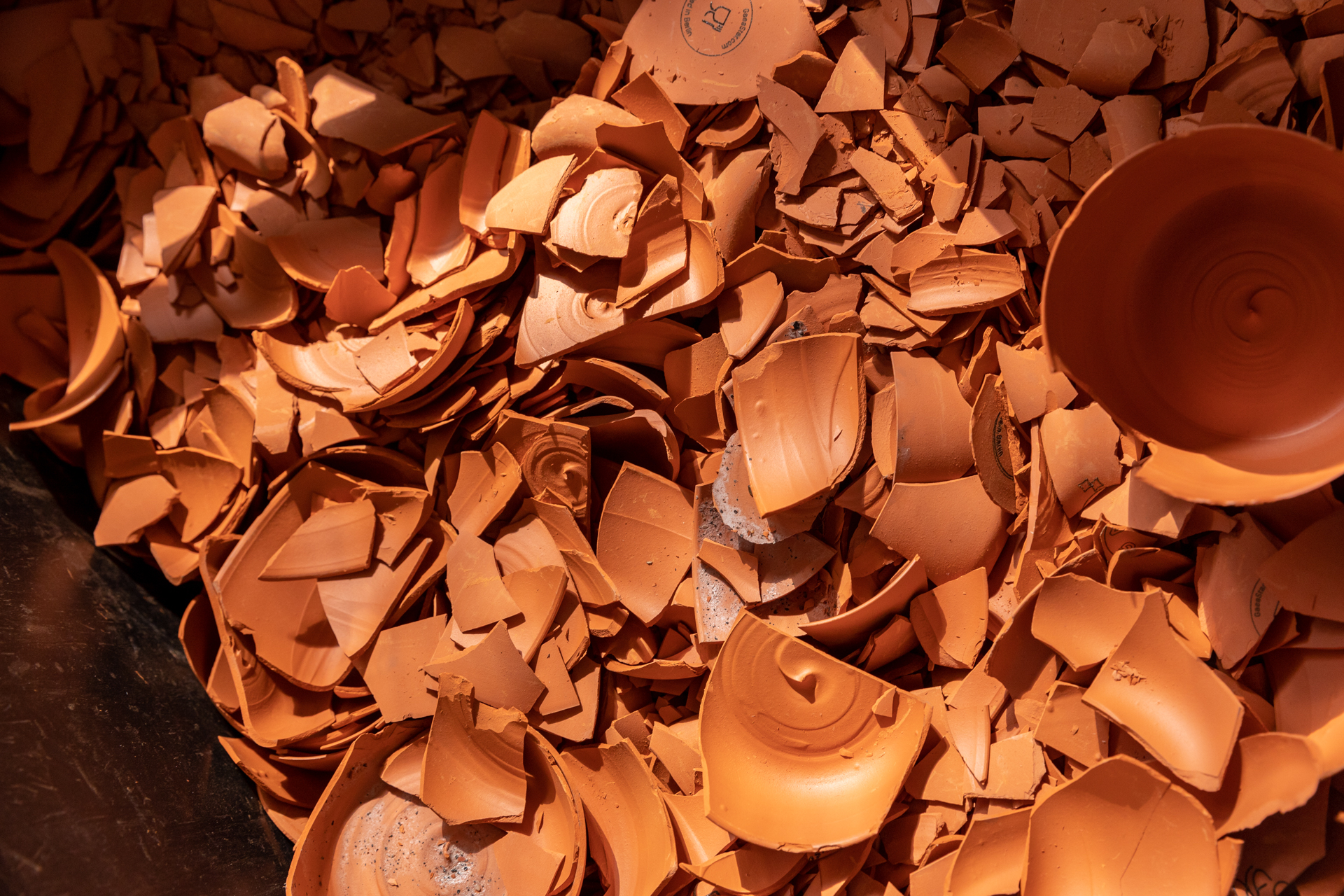 Gaestar's disposable clay cups, smashed in a pile.