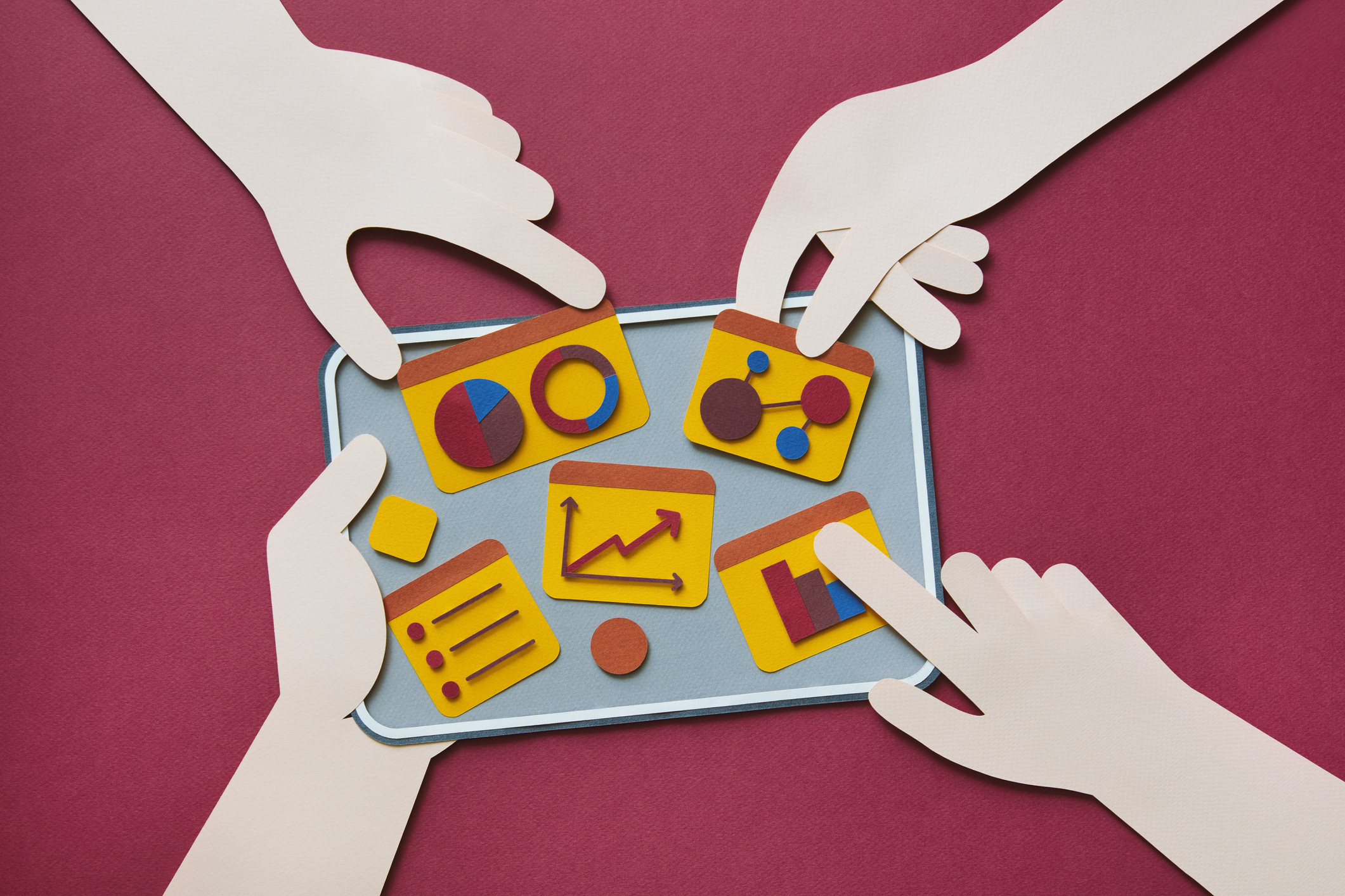 Paper craft illustration of digital tablet with charts. Teamwork concept