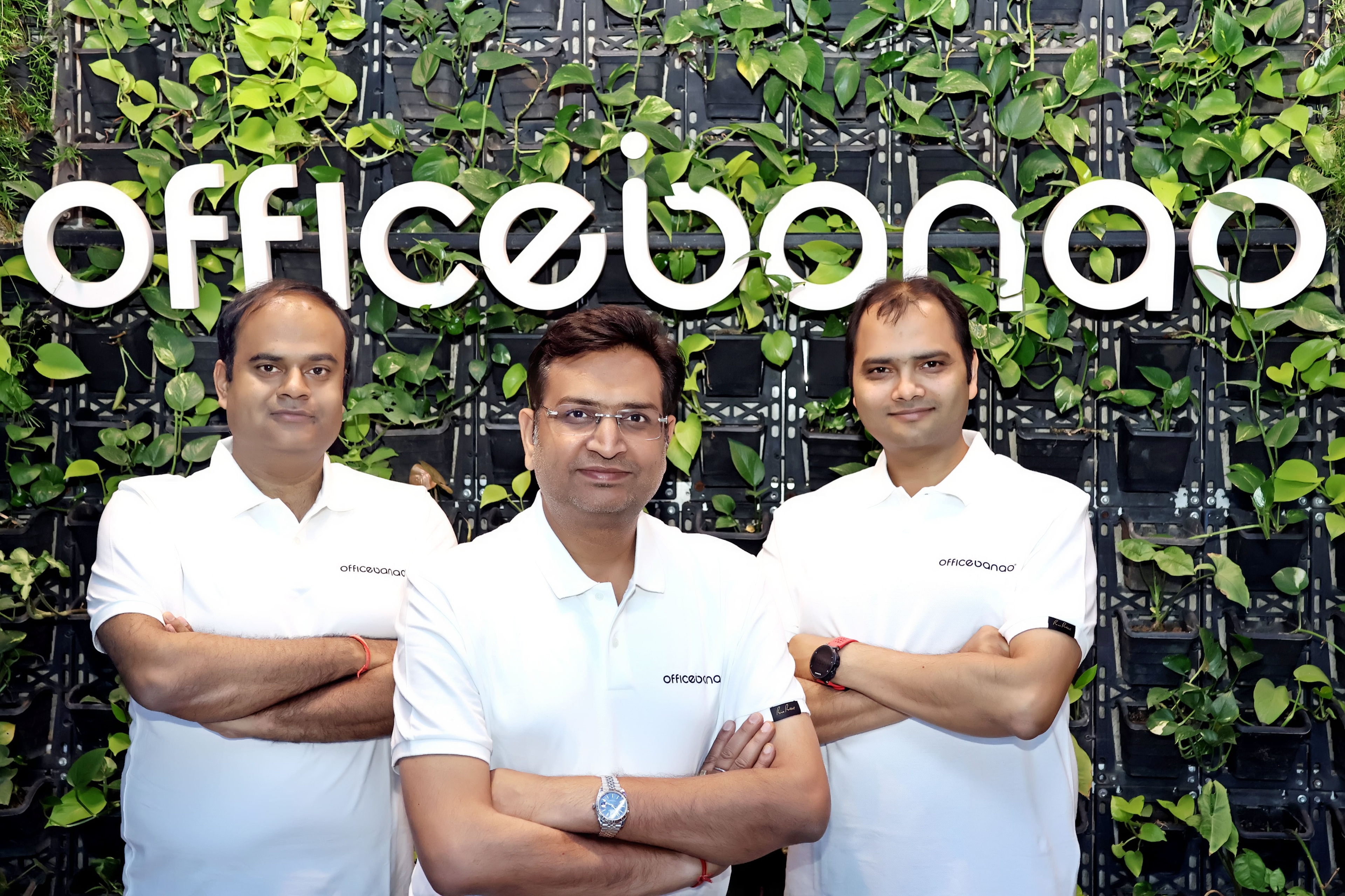 Officebanao founders pose in front of company sign