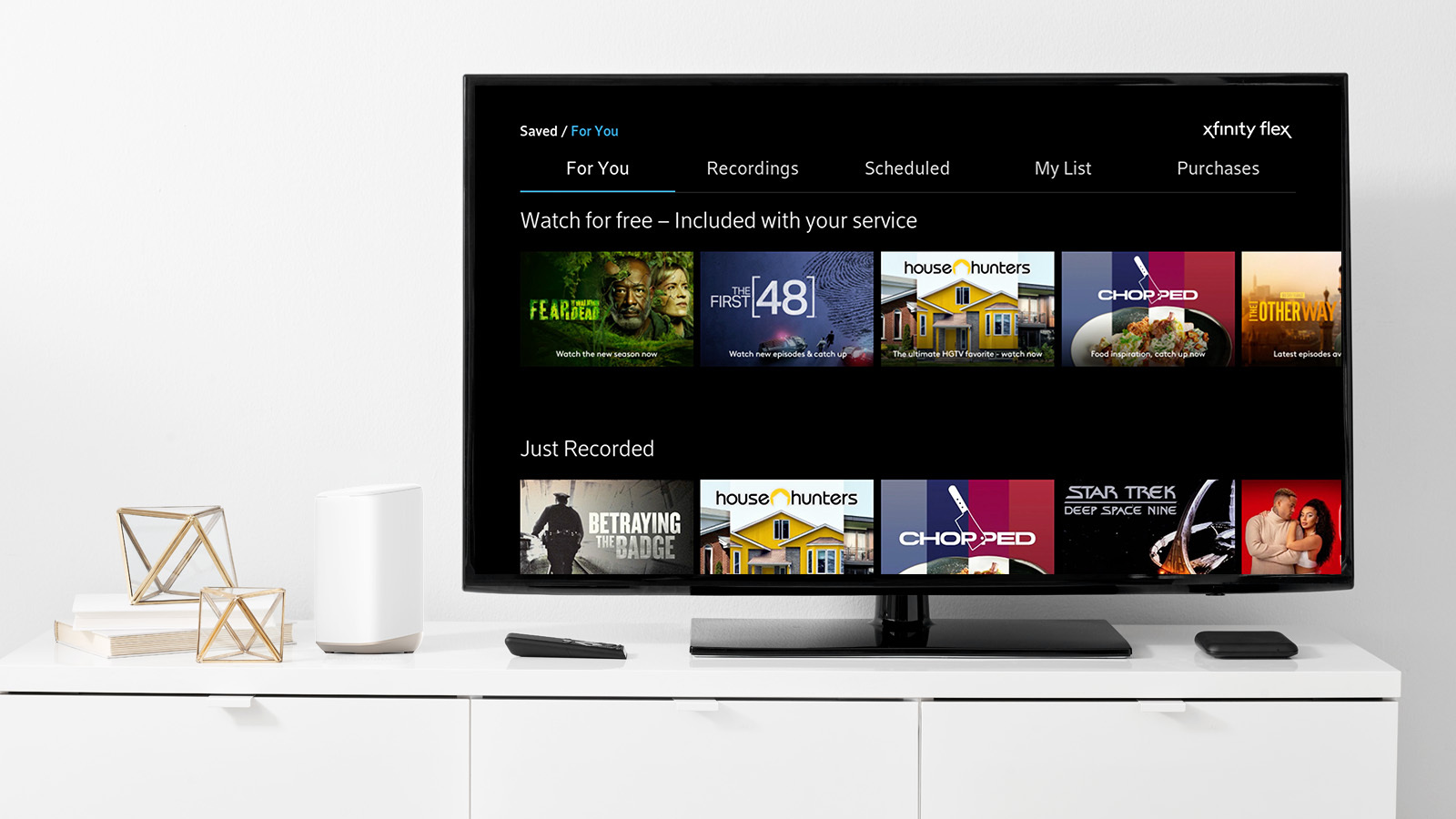 TV on credenza displaying Comcast NOW TV