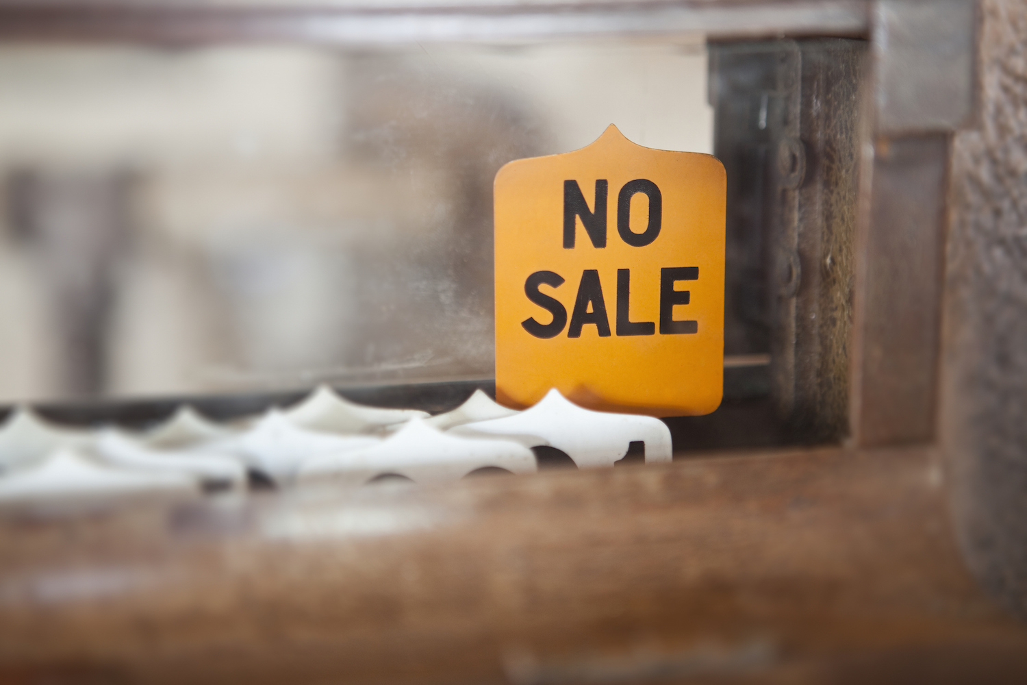 A 'NO SALE' sign on an Antique Cash Register