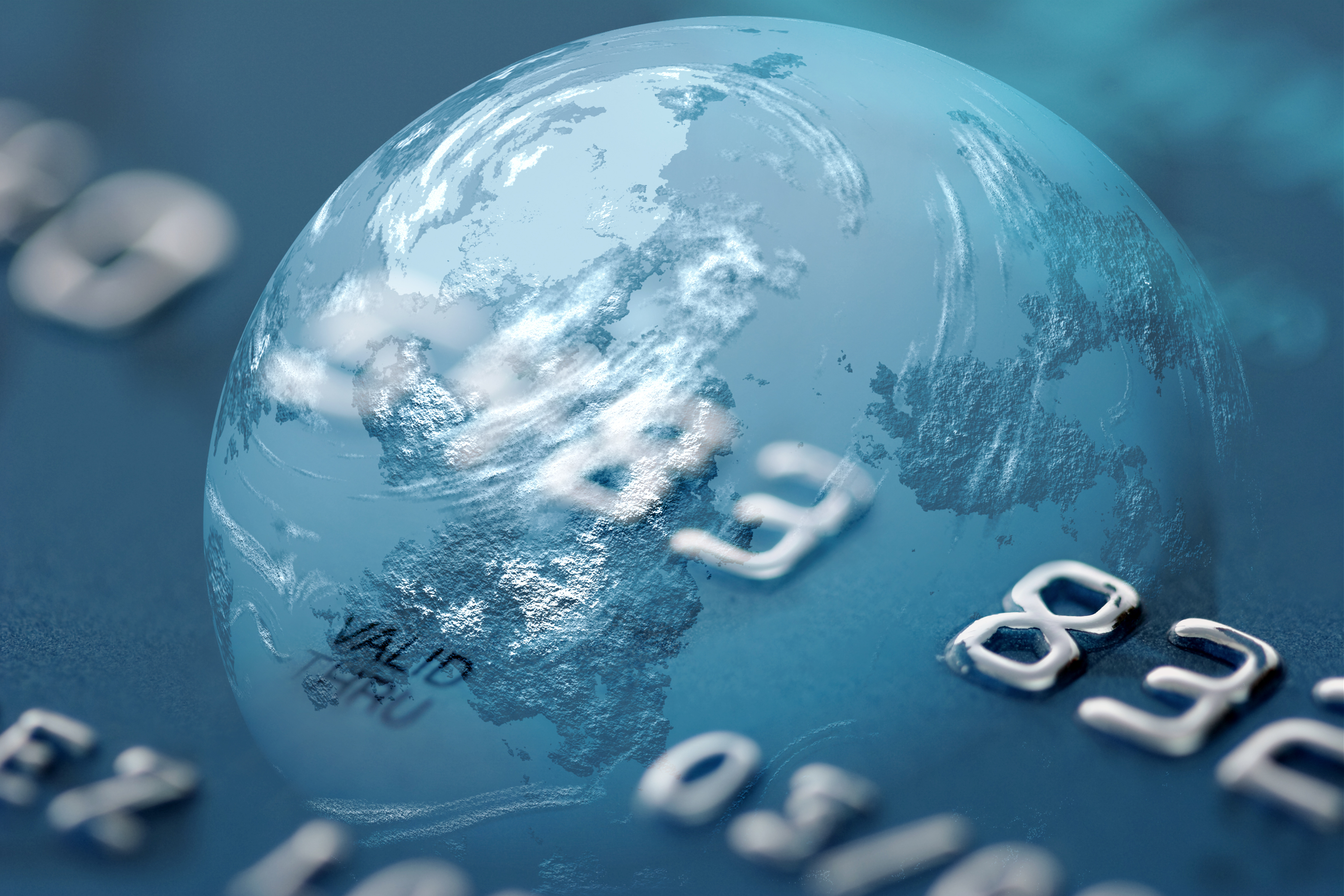 Globe reflected in a credit card