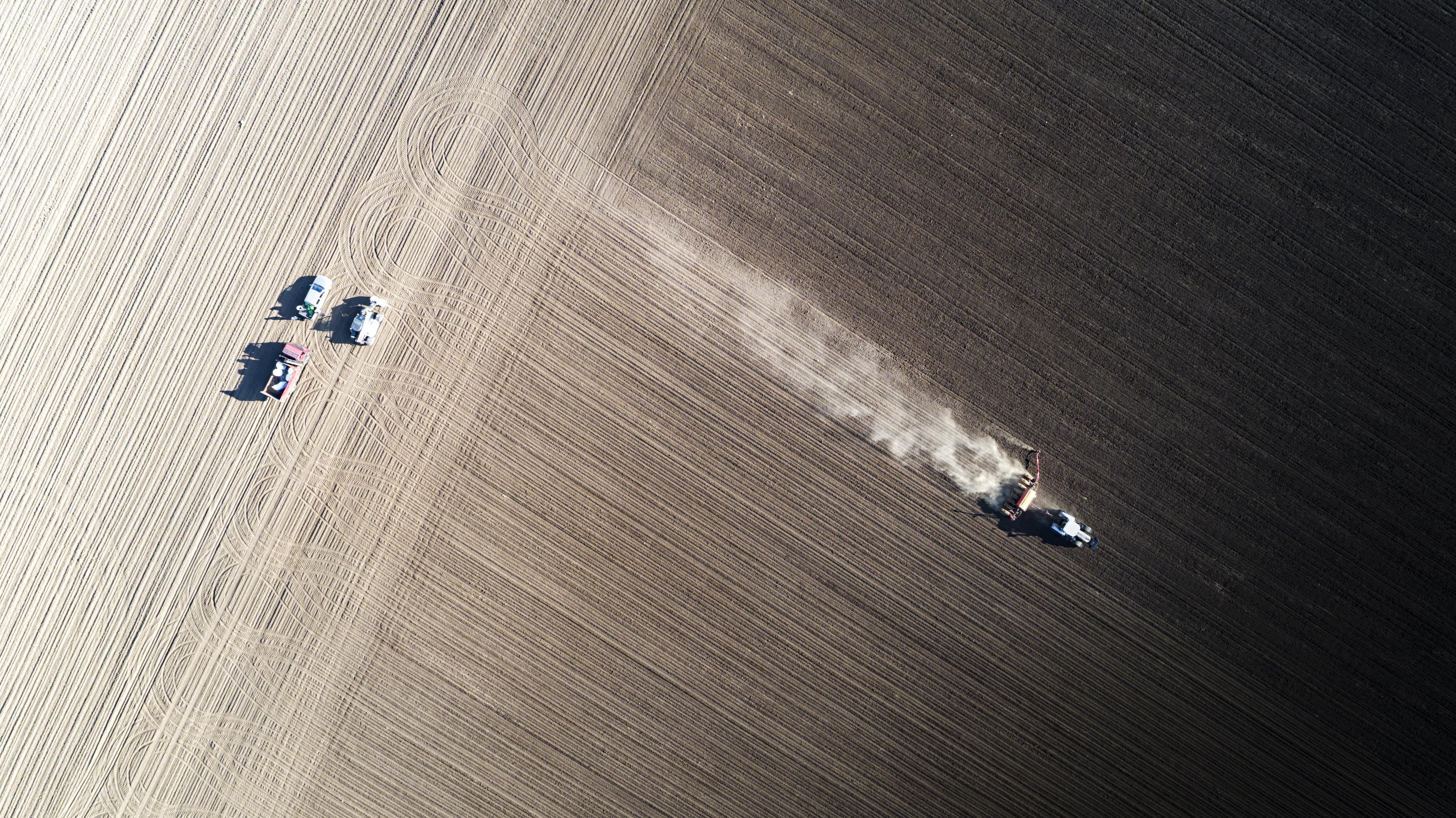 Tractor spreading soil ammendment