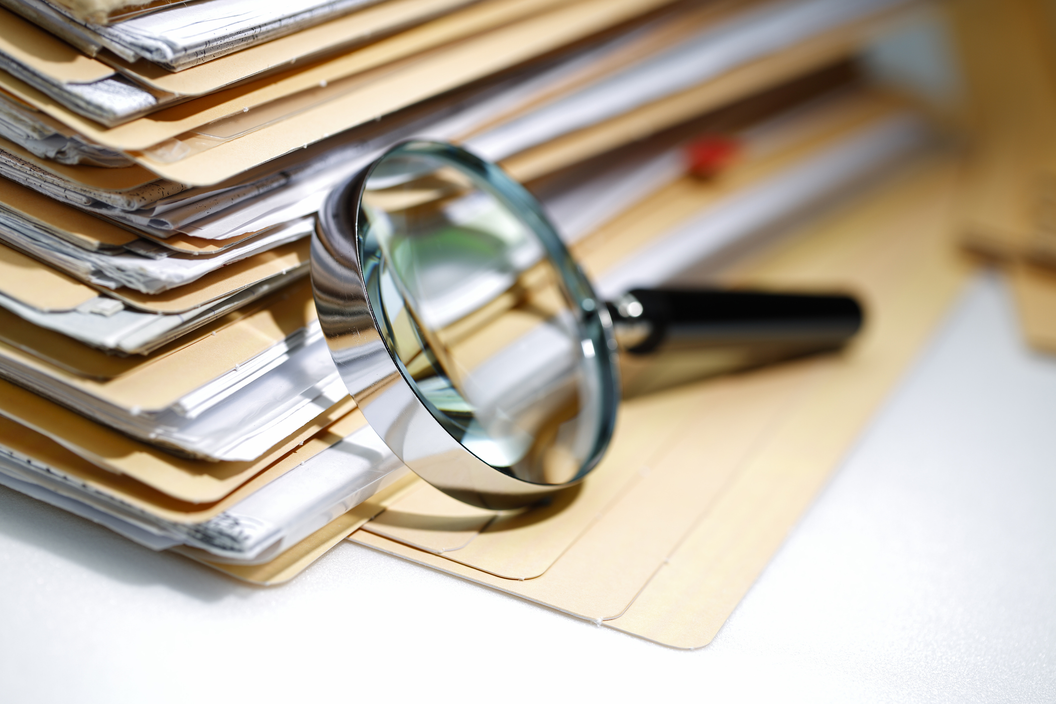 Magnifying glass Search Documents ; shot with very shallow depth of field, used in post about Fileread