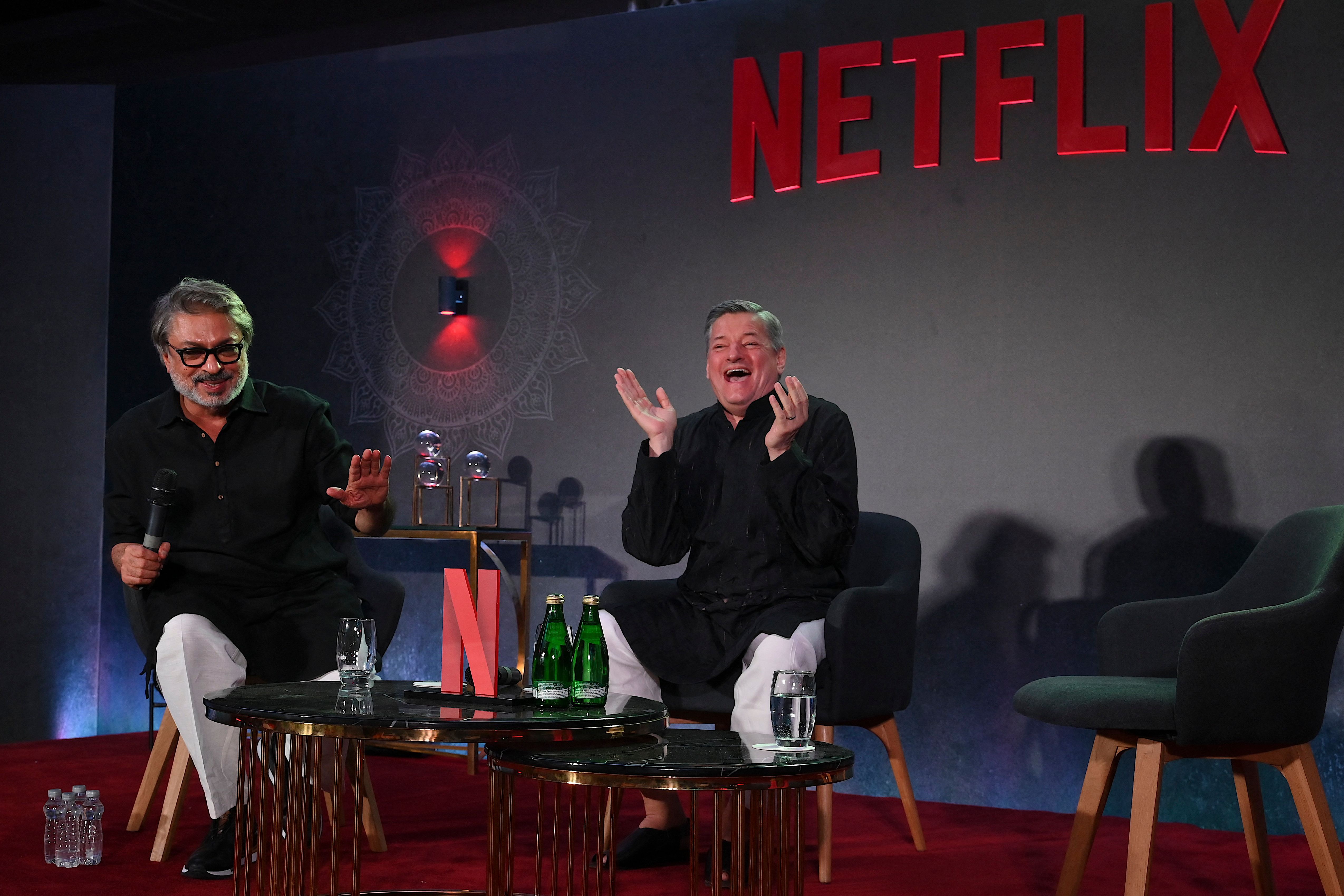 Bollywood director, screenwriter and music composer Sanjay Leela Bhansali (L) along with American businessman and co-chief executive officer of Netflix, Ted Sarandos.