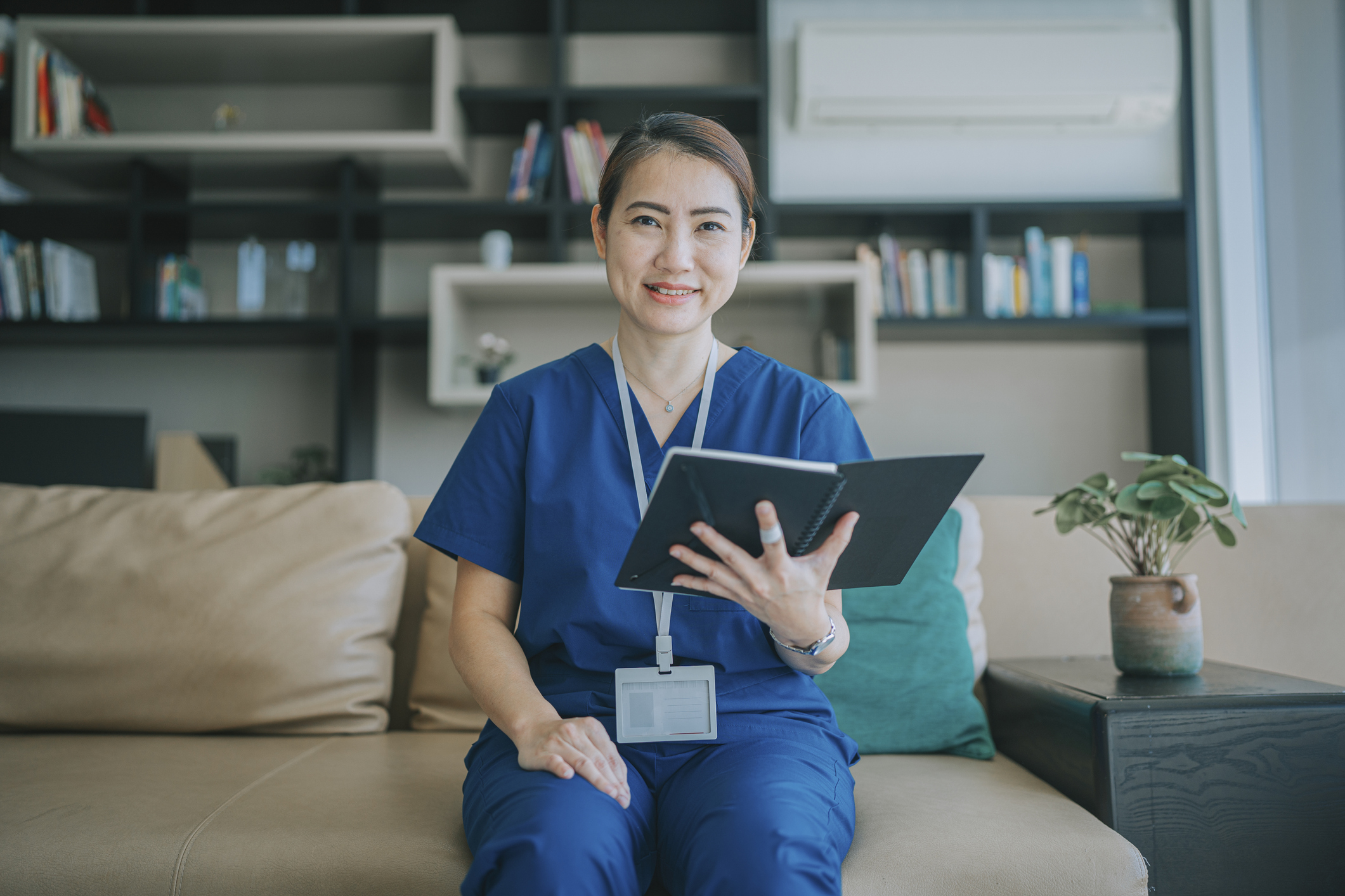 Female doctor with tablet getting ready for a telehealth conference, used in a post about HealthXCapital and Jungle Ventures