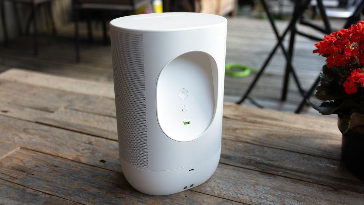 Sonos Move 2 on a wood table, back view showing the ports and handle