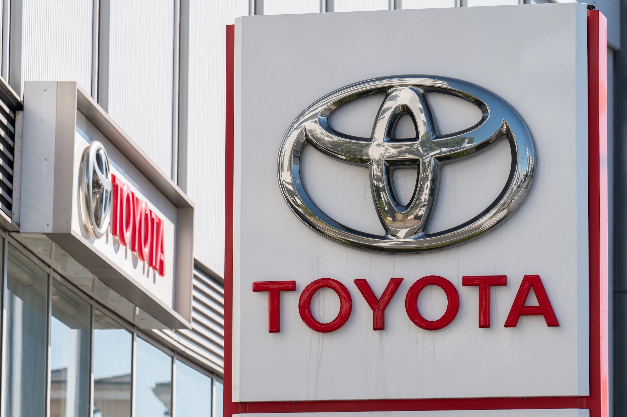Toyota sign displayed outside a Tokyo showroom.
