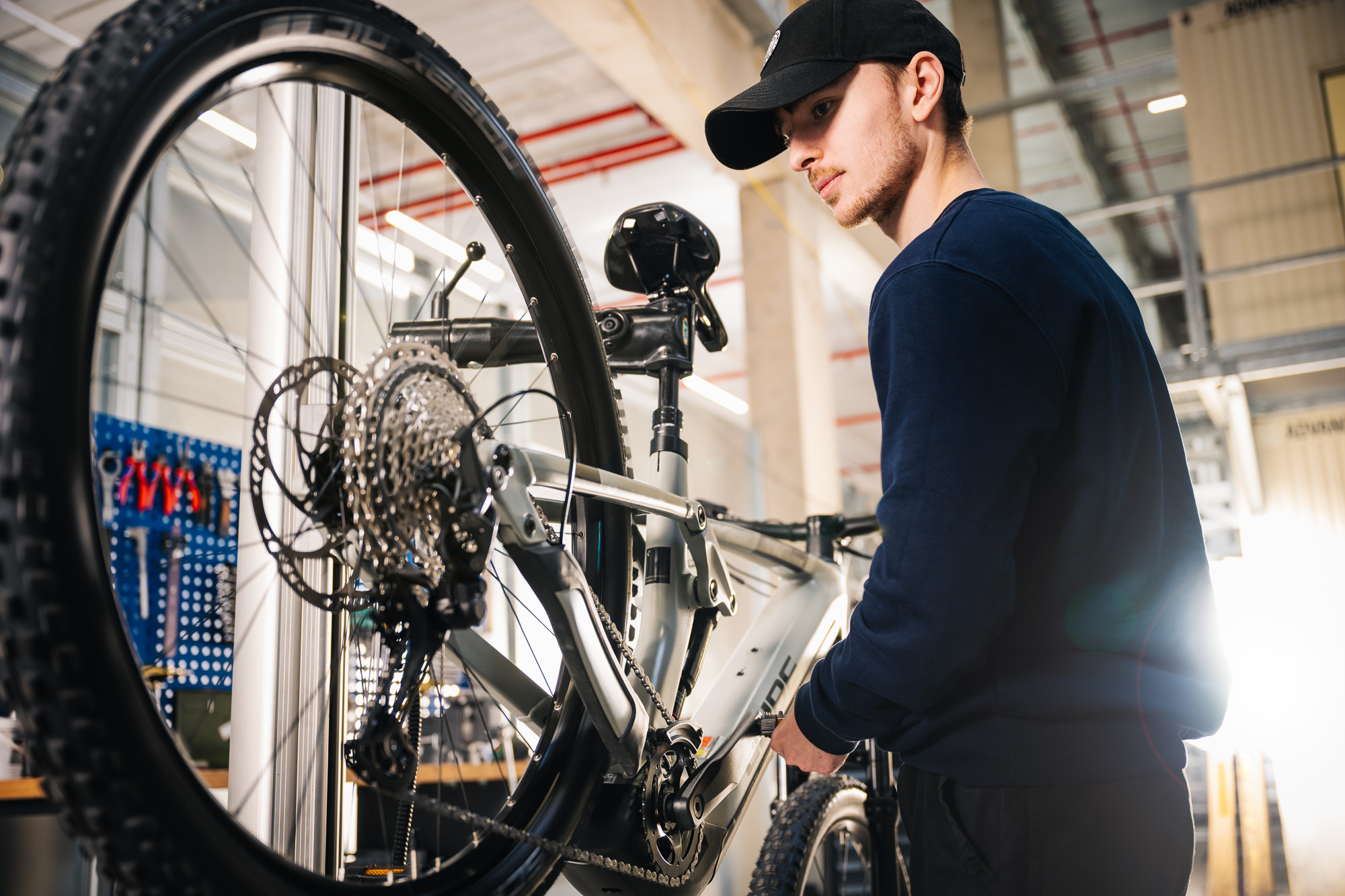 man fixing e-bike