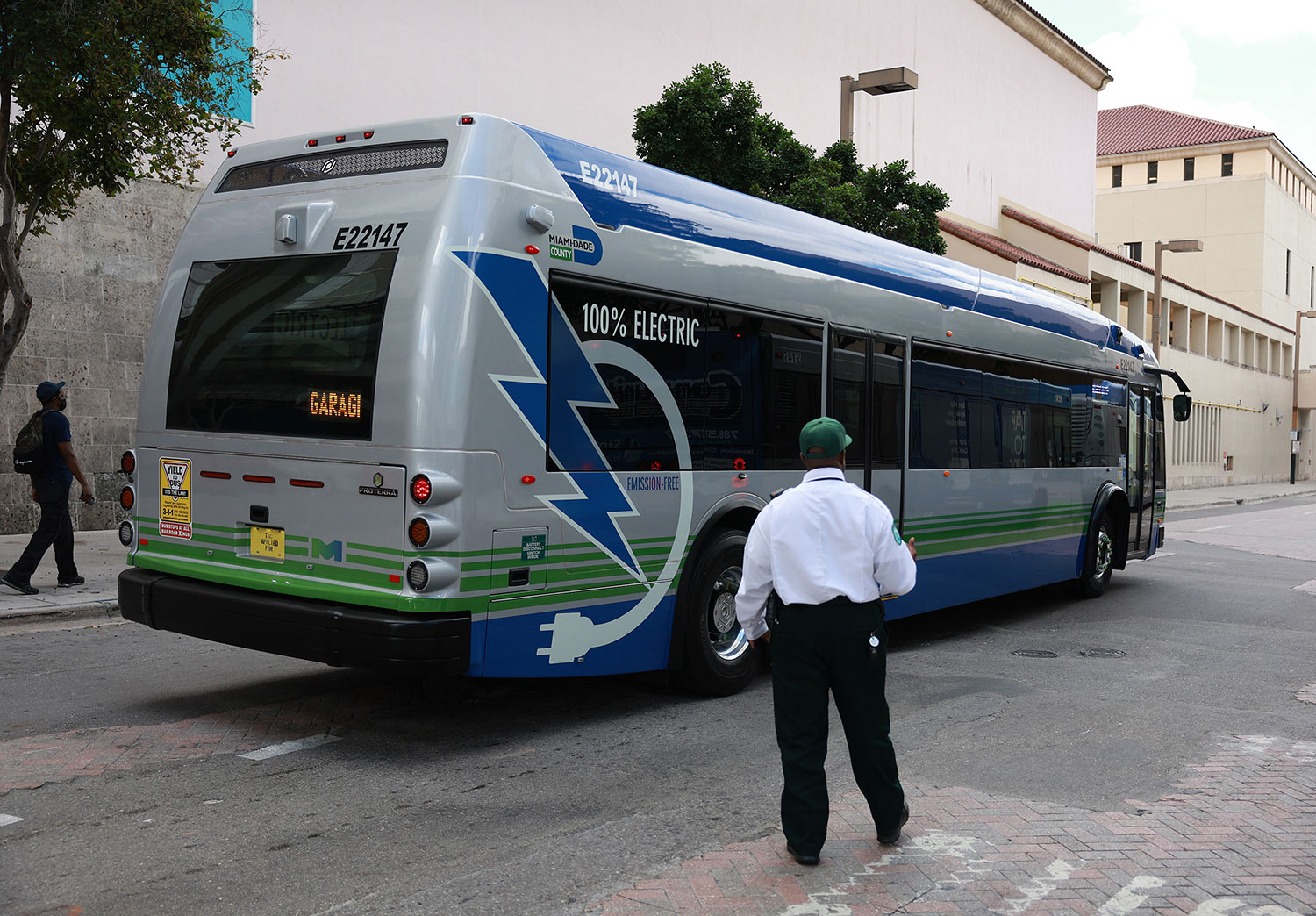 MIAMI, FLORIDA - FEBRUARY 02: A 40-foot, battery-powered electric bus drives along a street on February 02, 2023 in Miami, Florida. Miami-Dade County announced today that its transit system has begun using 75 Proterra ZX5 battery-electric buses. The new fleet is both advancing the county's climate action strategy by reducing emissions and creating cost savings for transit riders and residents alike. (Photo by Joe Raedle/Getty Images)