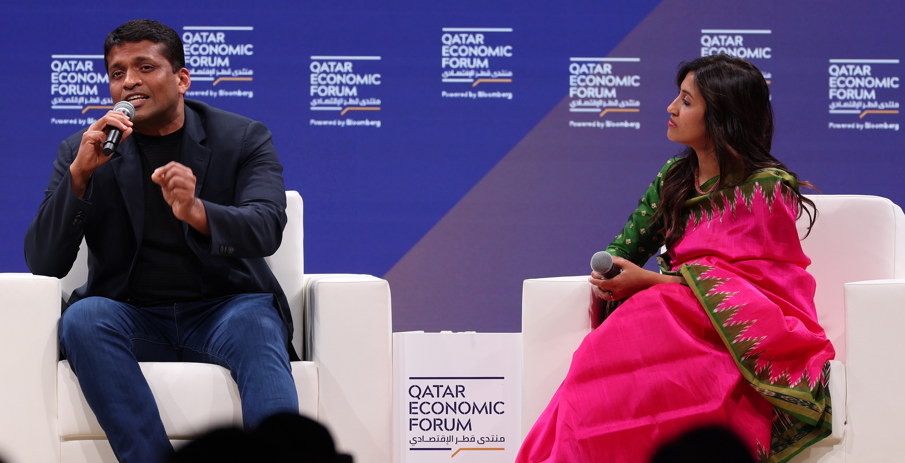 2 speakers seated onstage at Qatar Economic Forum