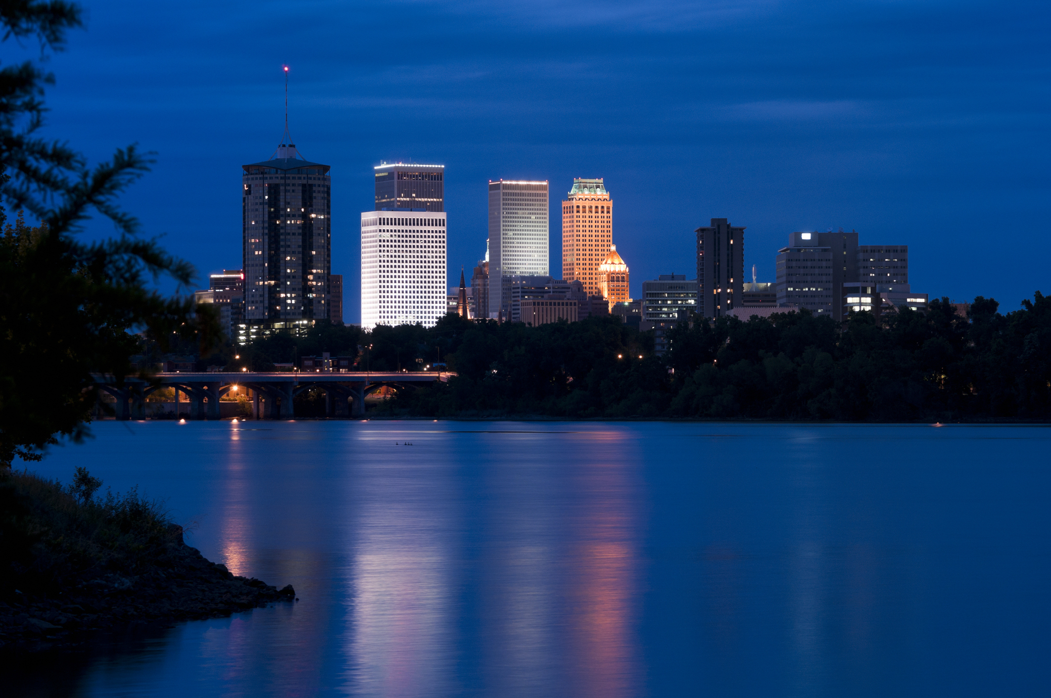 The downtown Tulsa Skyline from across the Arkansas River at dusk.