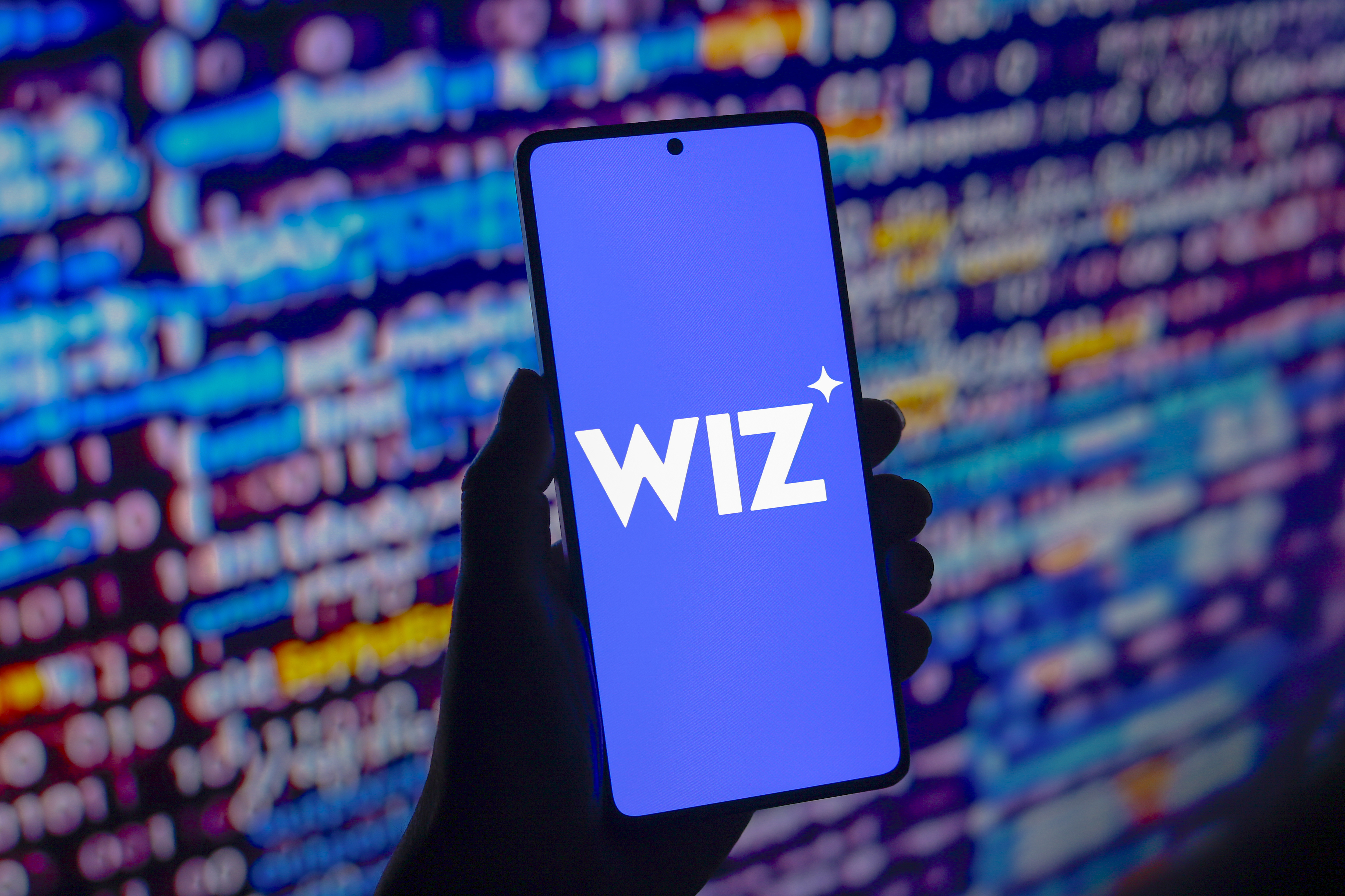 Wiz logo displayed on a smartphone