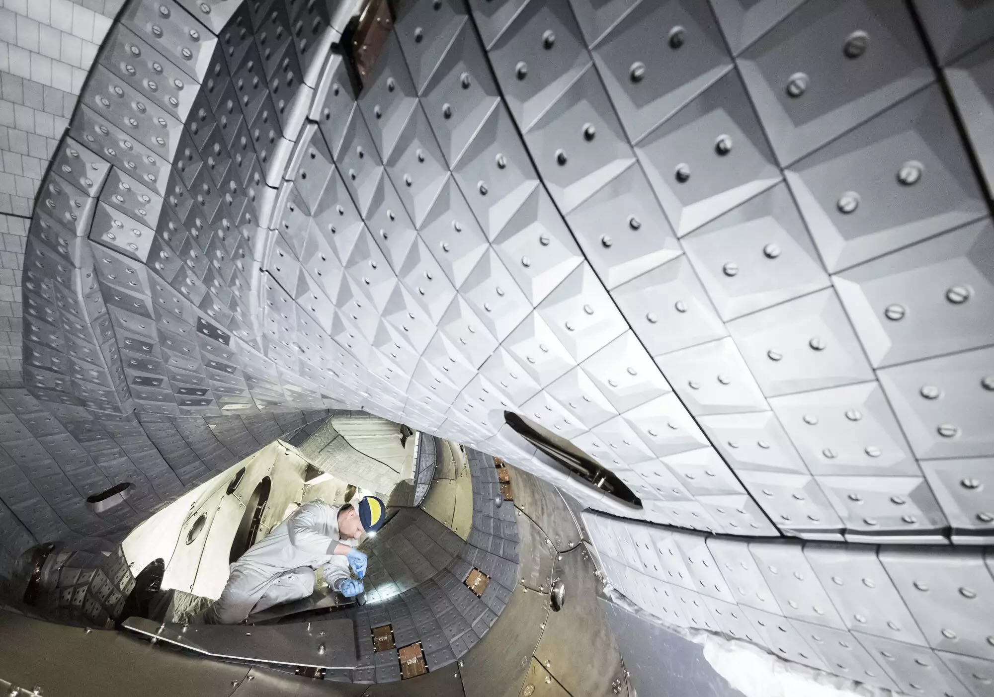An engineer works on the Wendelstein 7-X stellarator.