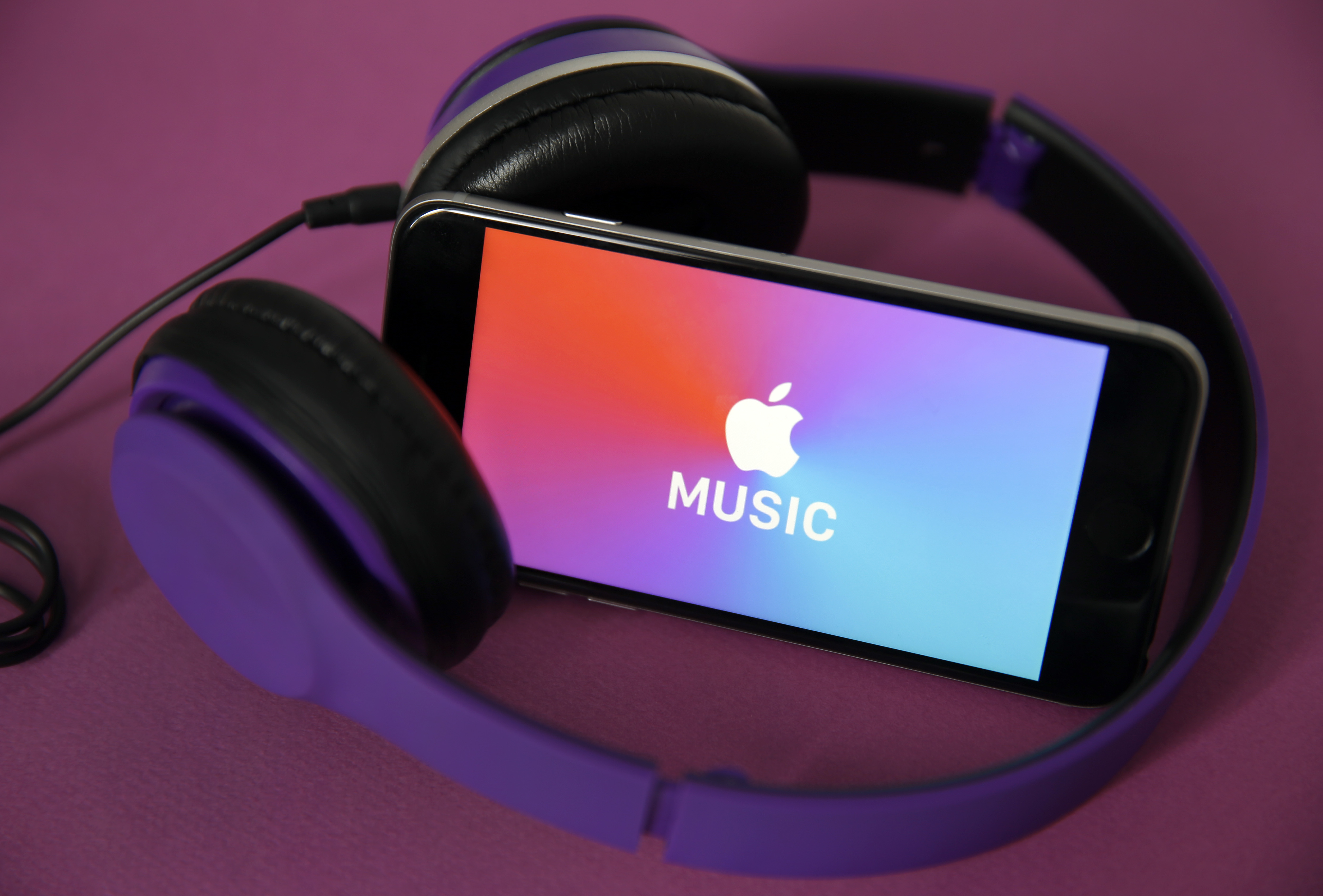 the logo of the music streaming platform Apple Music is displayed on the screen of an iPhone
