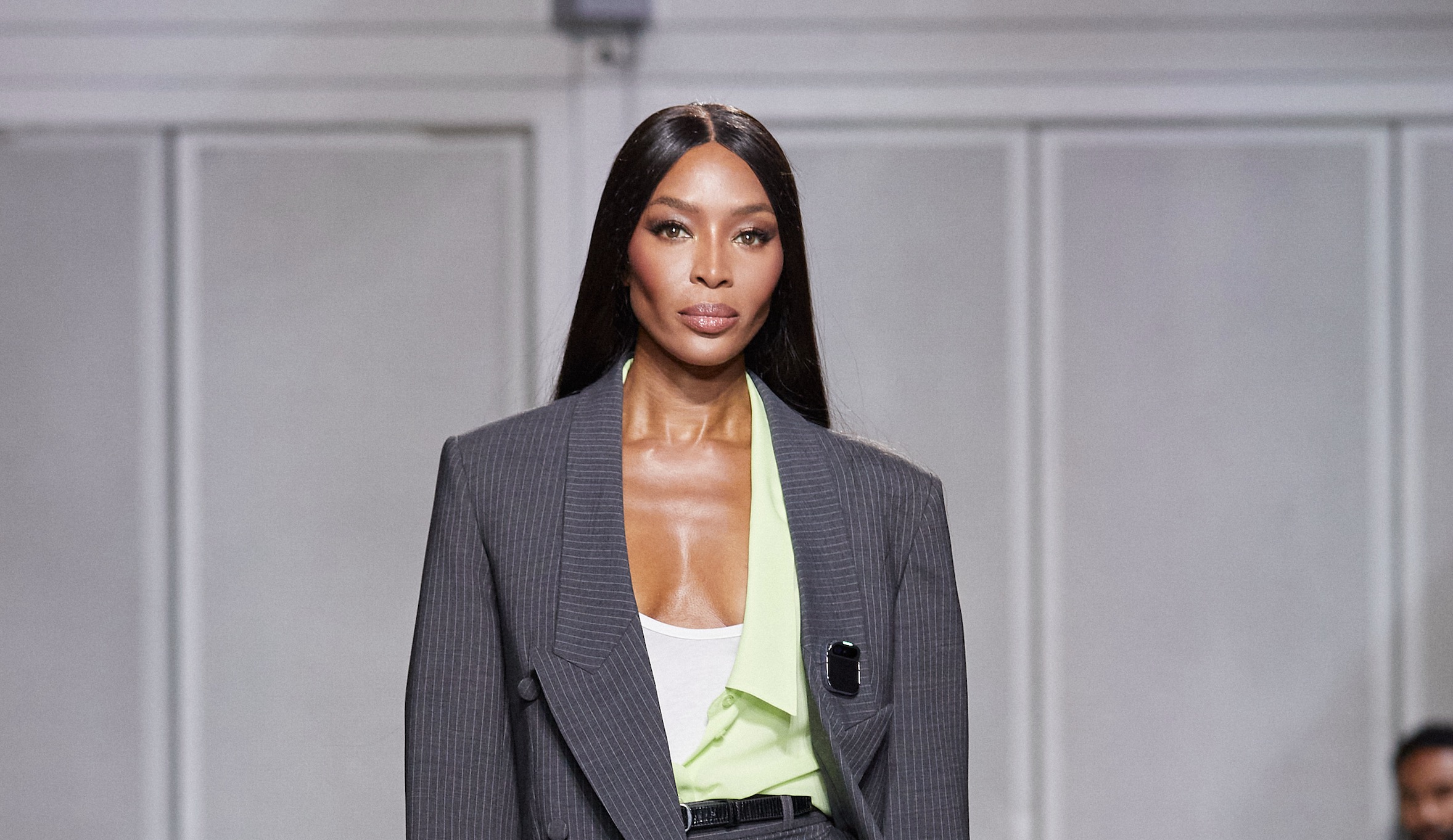 Naomi Campbell wearing a Humane pin