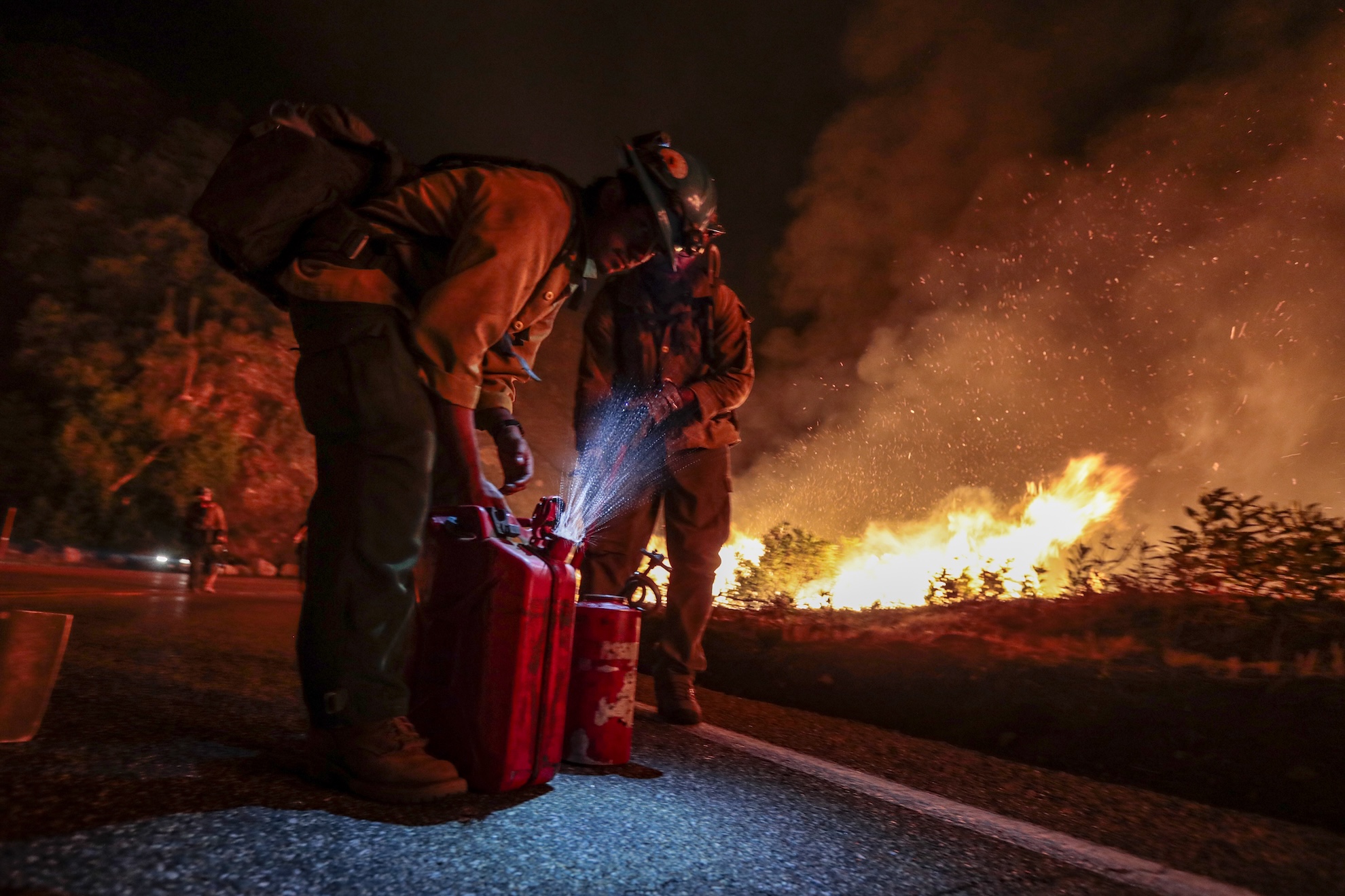 Blue Ridge Hot Shots crew members from Arizona join forces with California firefighters from Northern and Southern California on a backfire operation North of Mt. Wilson on Angeles Crest Highway.