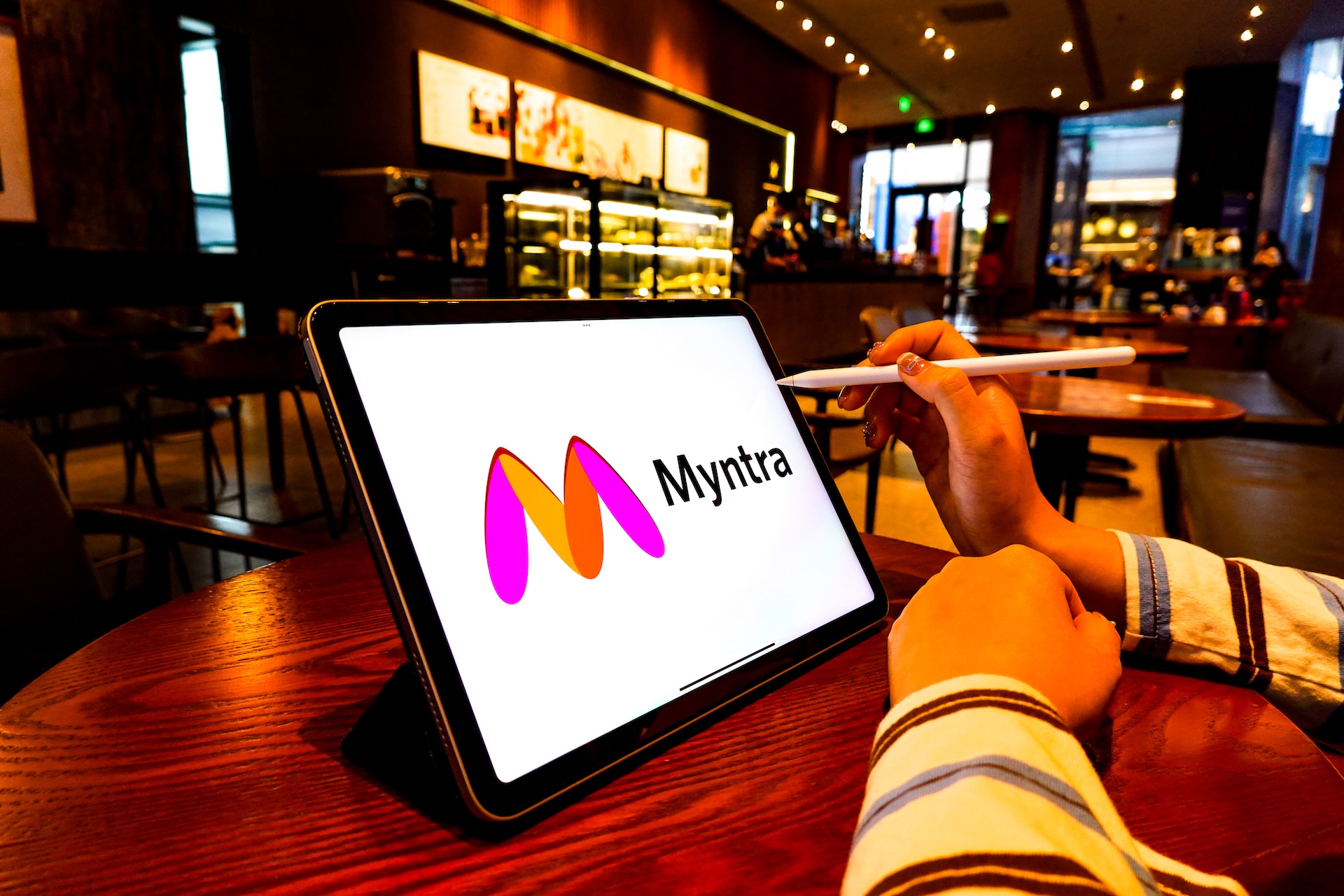 Myntra logo on iPad screen
