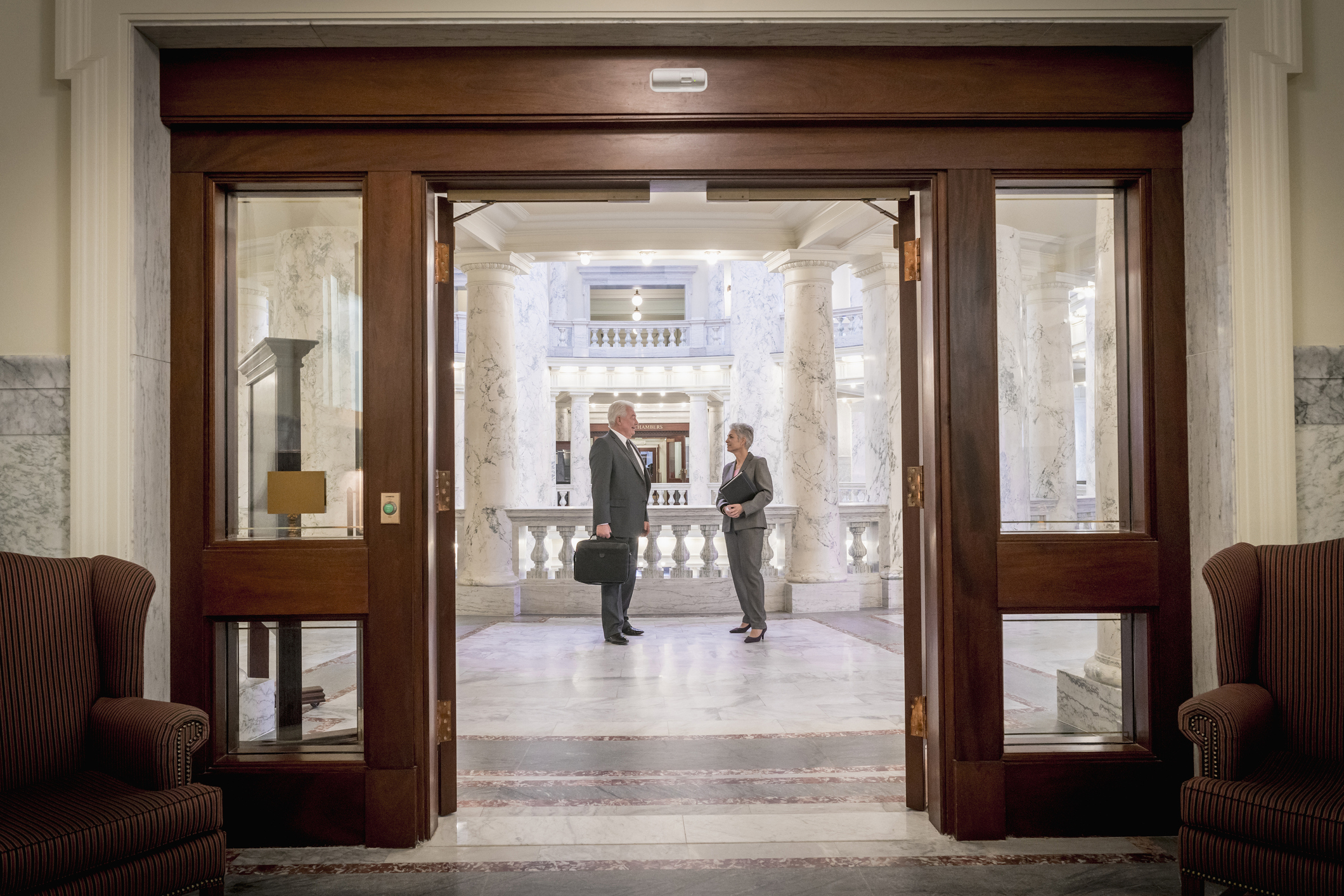 Politicians talking in capitol building