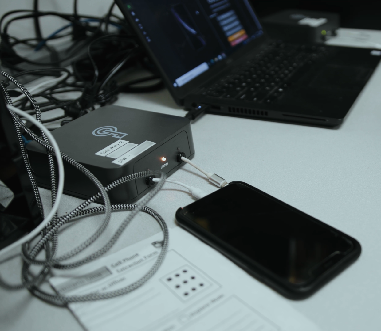 A man operates a Graykey phone hacking and unlocking device, made by Magnet Forensics. (Image: Magnet Forensics)