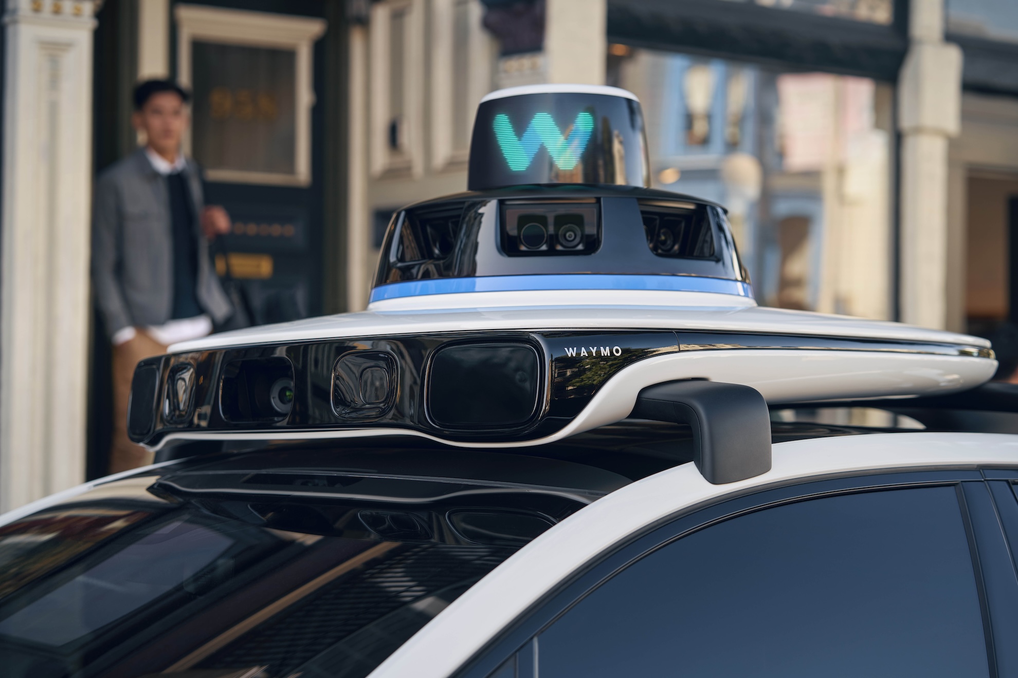A close up of the rooftop of a Waymo robotaxi that shows sensors.