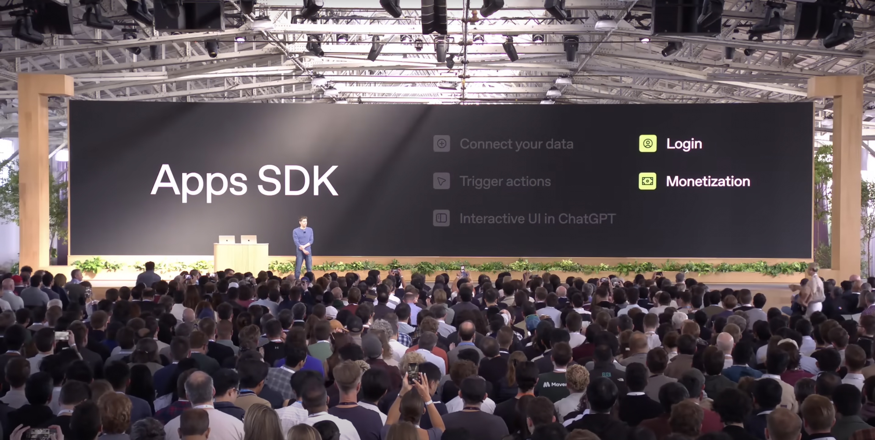 Sam Altman presents before a crowd at OpenAI's dev day.