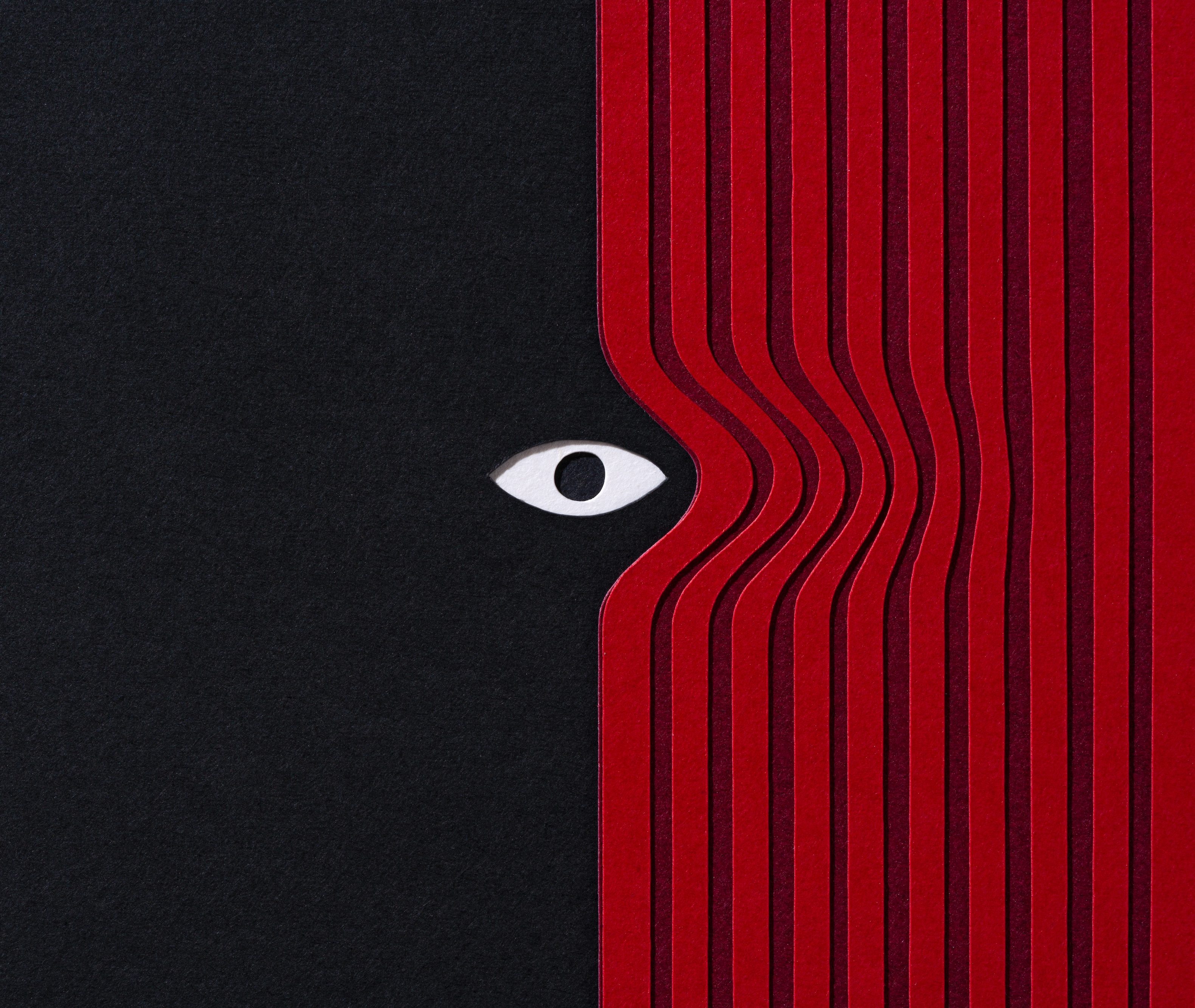 Paper Craft of Mysterious Eye Peering Out From Red Curtain on Black Background Front View.