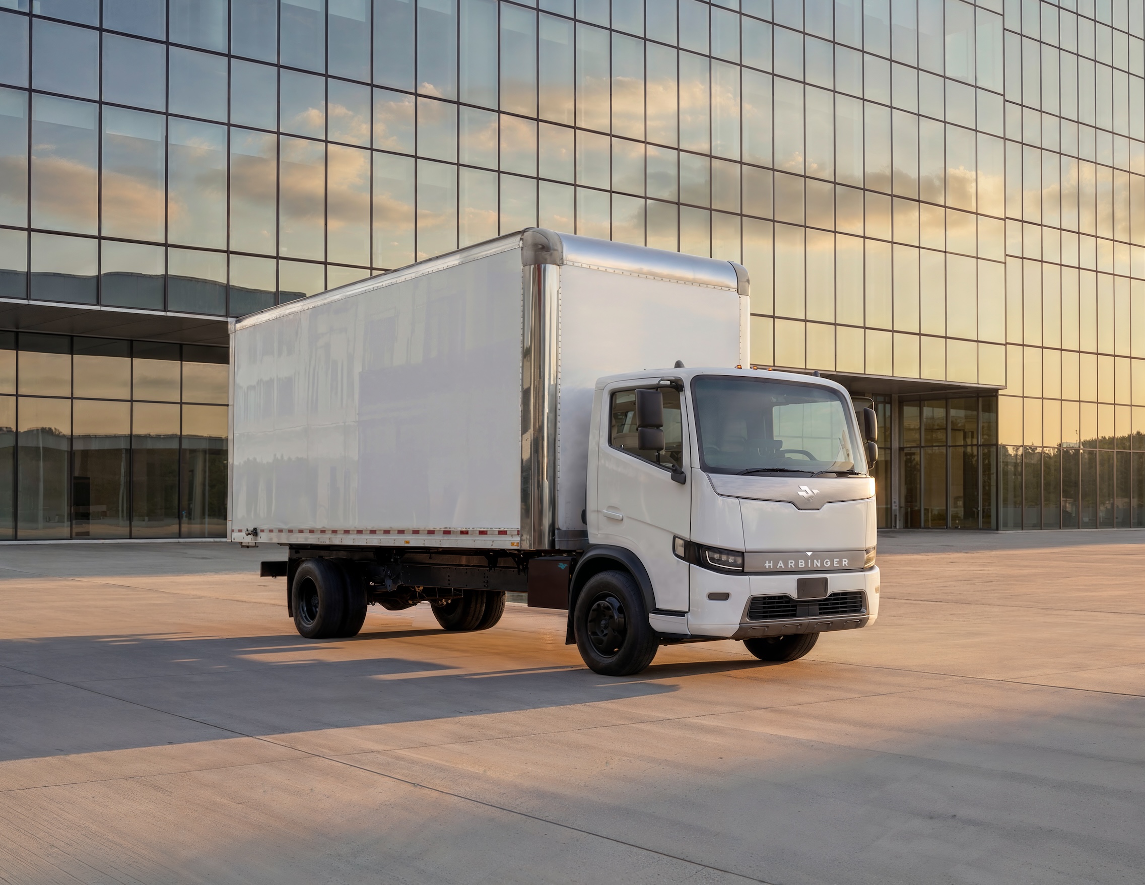 Harbinger truck parked in front of building