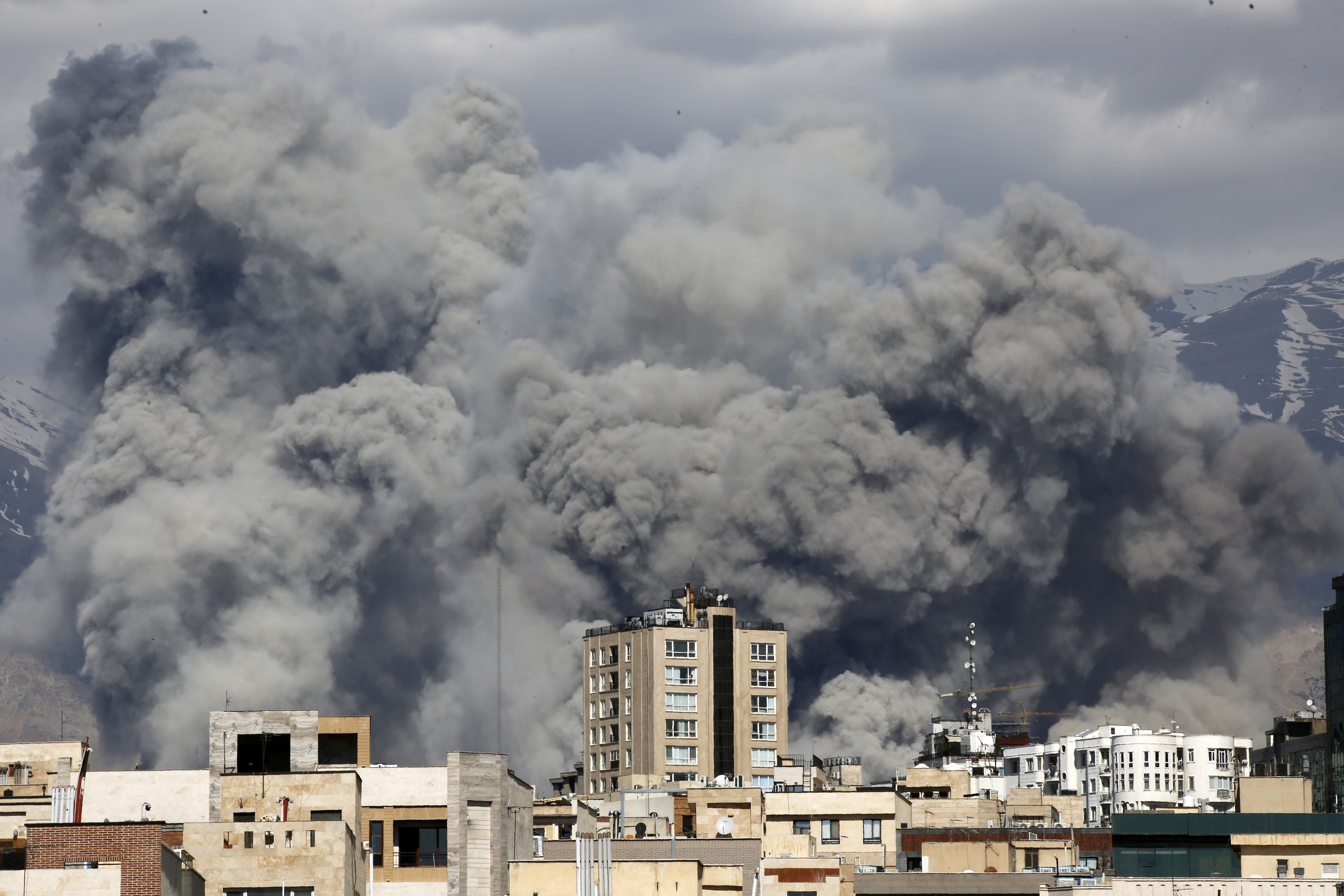Smoke rises from the area after it was targeted in attacks as a series of explosions are heard in Tehran, Iran on March 01, 2026. The Islamic Republic of Iran Broadcasting (IRIB) building after Iranian authorities said it was targeted in the attacks.