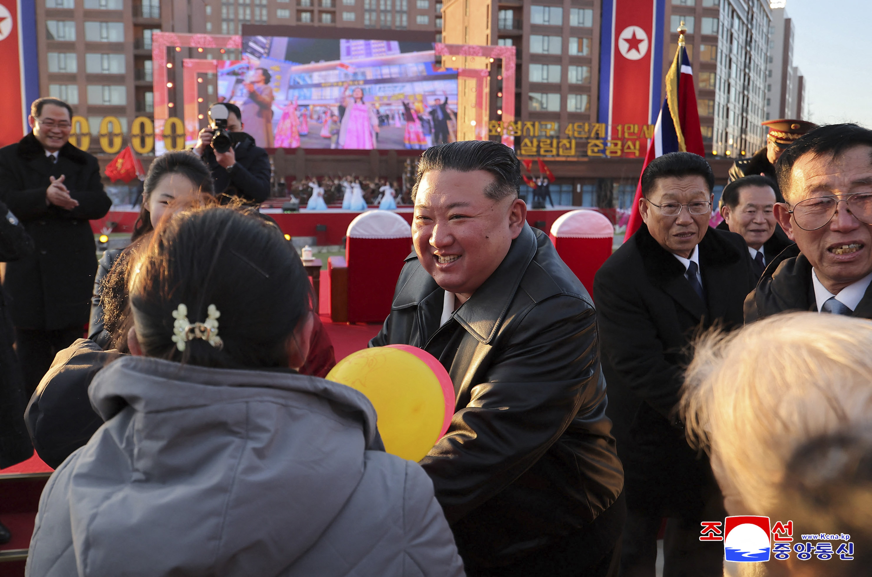 North Korean leader Kim Jong Un congratulating residents moving into their new homes at the inauguration ceremony of 10,000 flats at fourth stage in Hwasong area of Pyongyang.