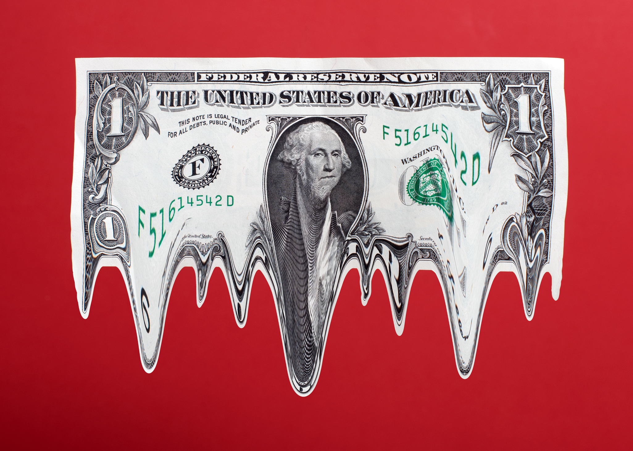 US $1 dollar bill in mid-air, melting