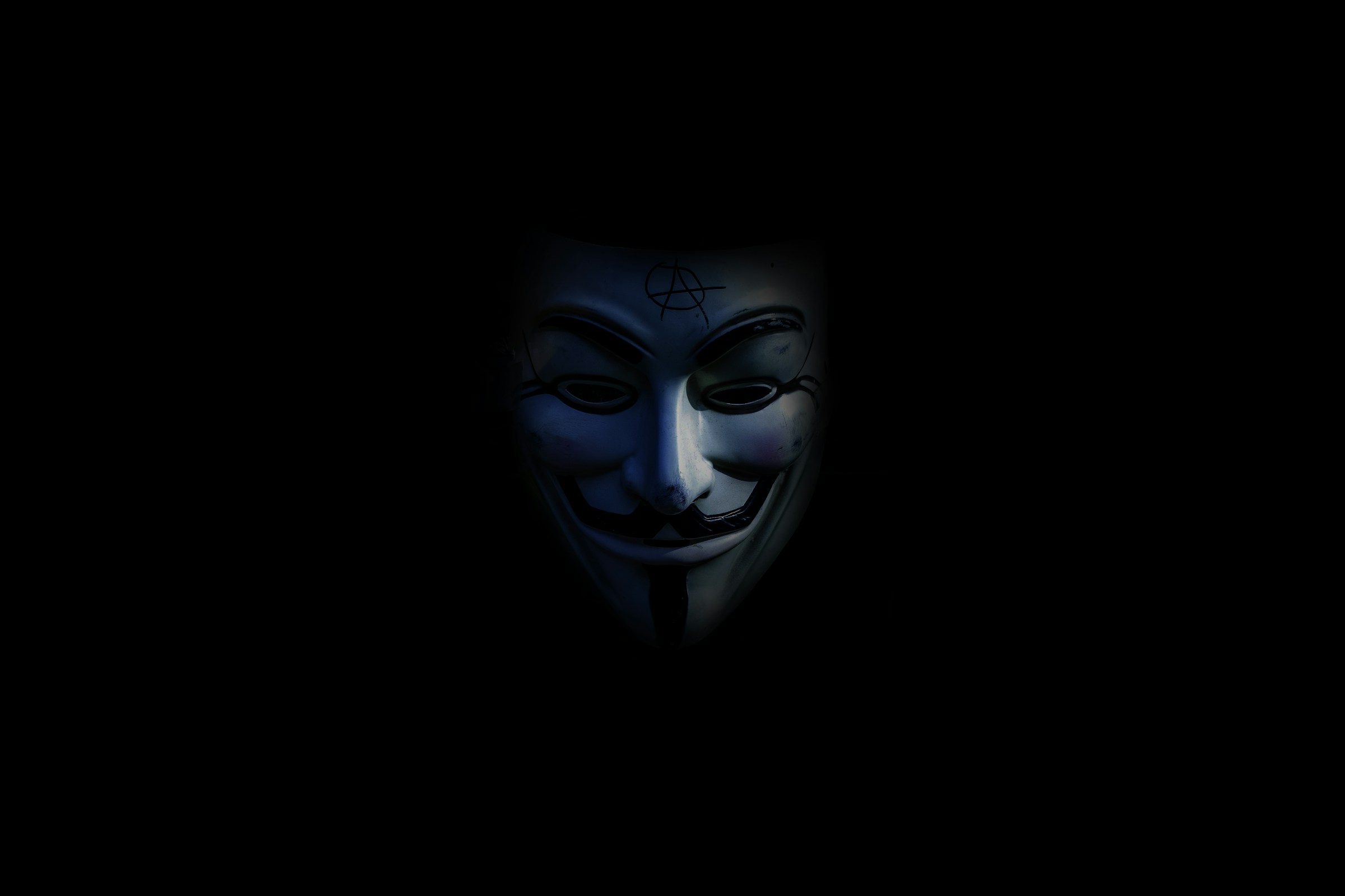 An illustration of the V for Vendetta Guy Fawkes' mask, which became synonymous with the hacking group Anonymous in the 2010s.