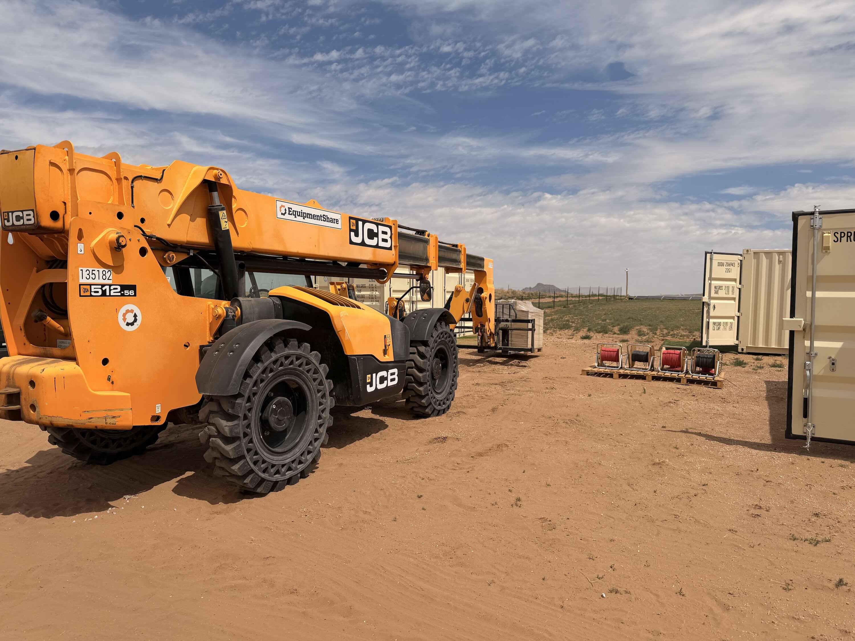 A fork lift works at a job site.