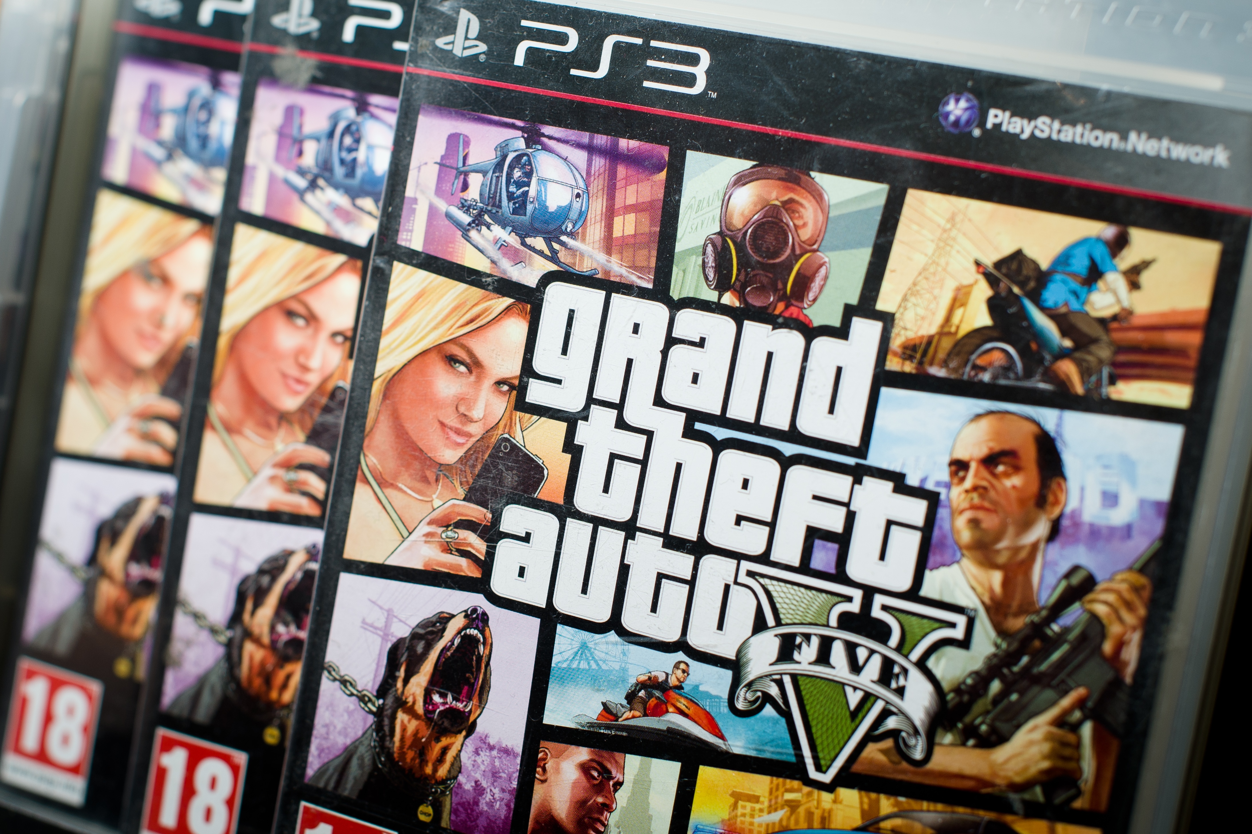 Close view of the packaging of the console game Grand Theft Auto 5.