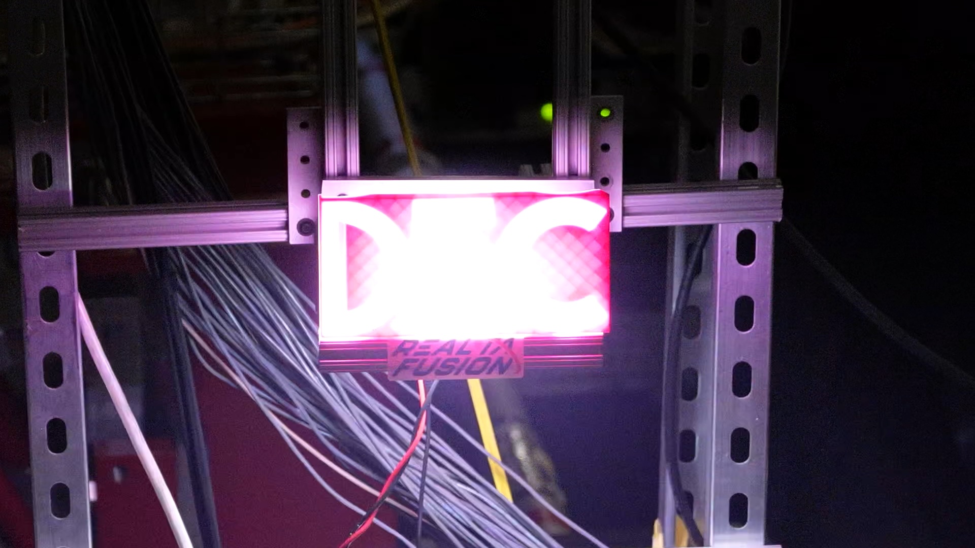 A sign that says DEC is lit with purple backlighting.