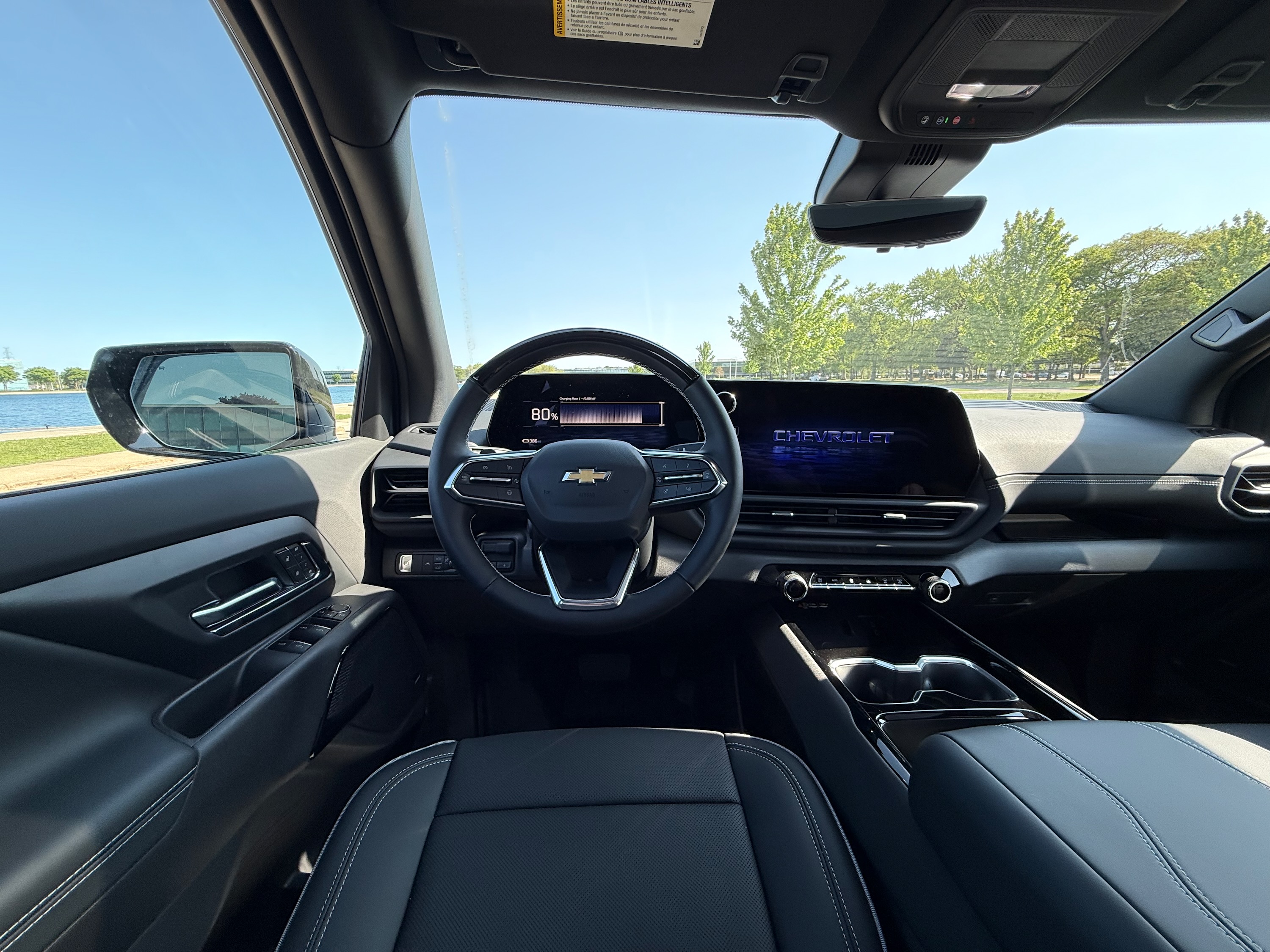 A screen shows 80% inside an electric pickup truck.
